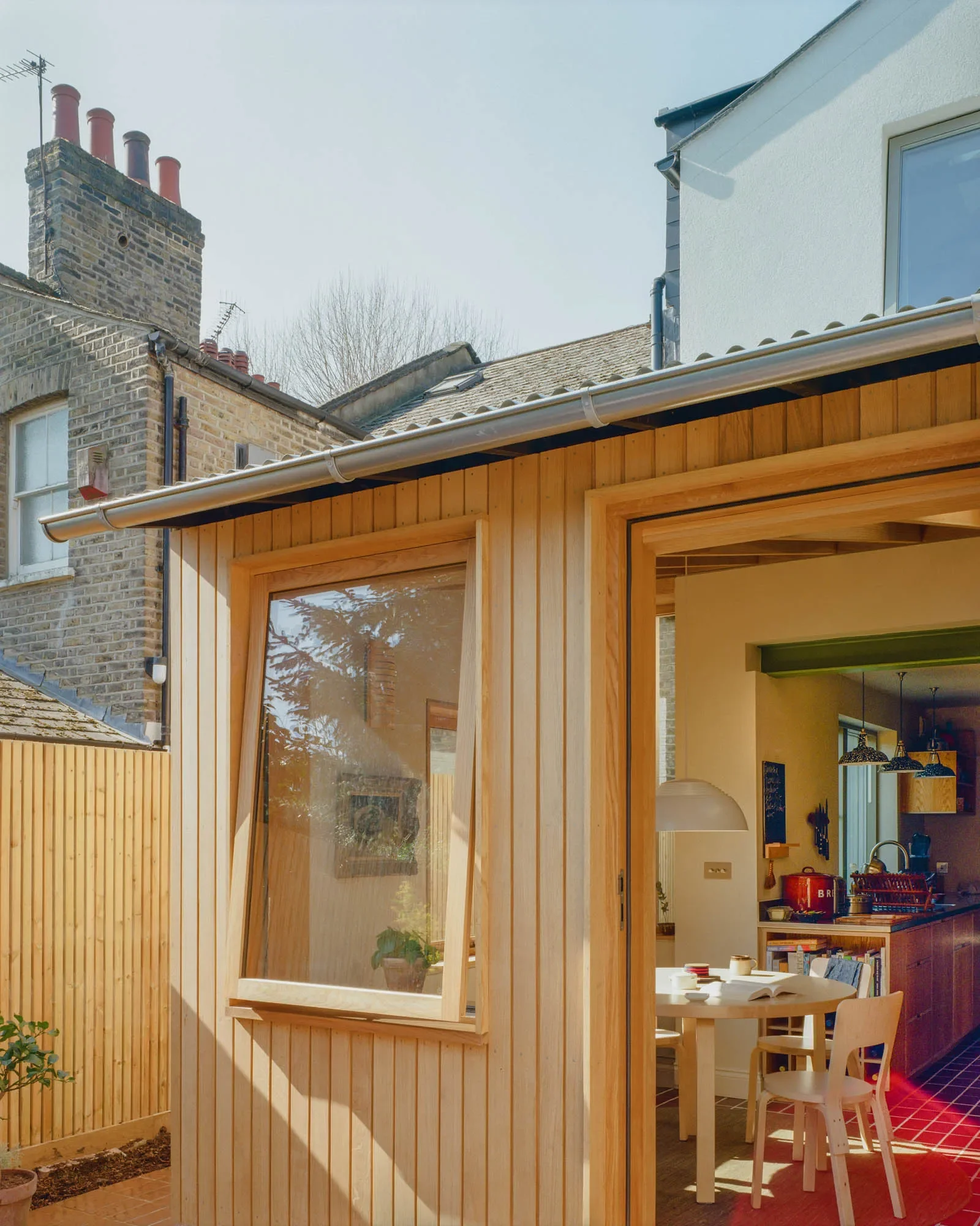 View into dining space from the garden and terrace © Owen Vidler