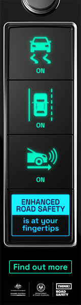 A vertical vehicle control panel with three illuminated buttons. The top button shows a car with wavy lines underneath, indicating traction control, labeled 'ON.' The middle button displays a car with parking sensors, also labeled 'ON.' The bottom button features a car vacuum cleaner icon with wireless signals, labeled 'ON.' Below the buttons is a blue banner with the text 'ENHANCED ROAD SAFETY is at your fingertips' and a black button labeled 'Find out more.'