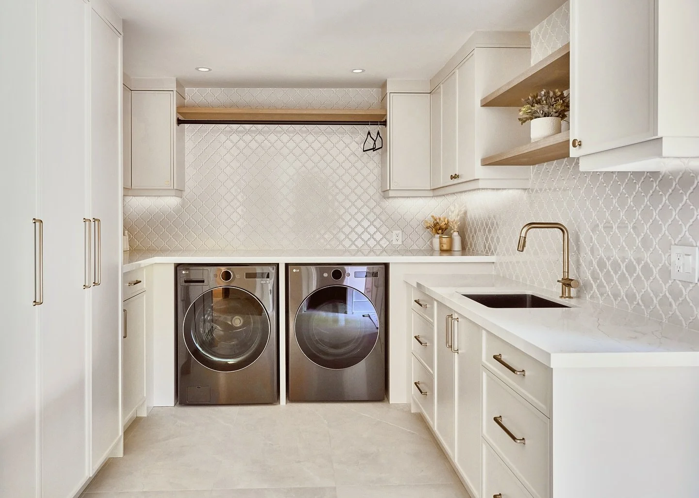What was once a basic, overlooked laundry room/mudroom is now a warm, subtle and feminine retreat.  Swipe to see the before ➡️ A dramatic laundry room transformation that feels calm, soft, and inviting. 
Design @rayneinterior 
Builder @braylynhomes