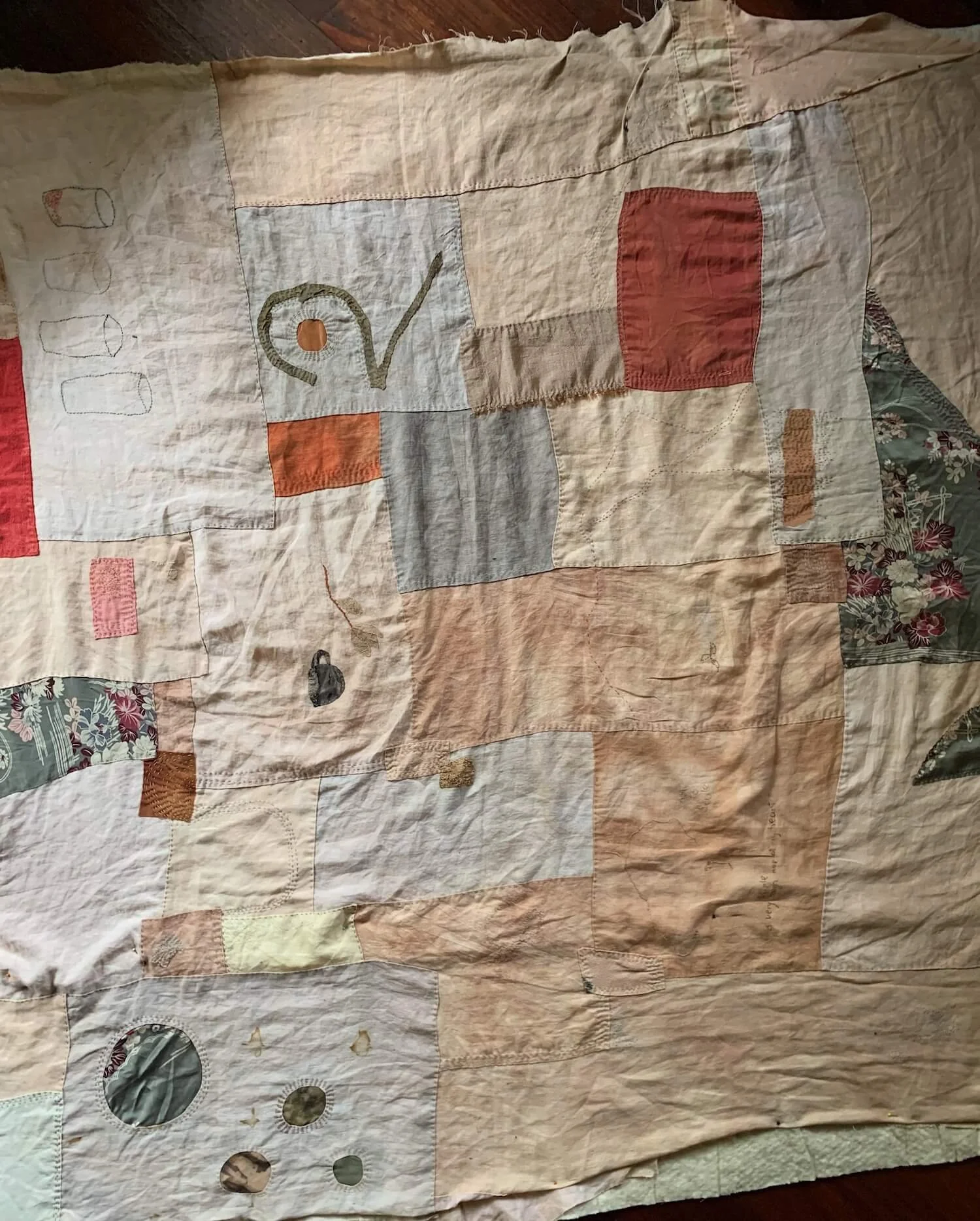 hand stitched sewn improv modern quilt with botanically dyed linen in pinks and reds embroidered.jpeg