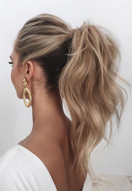 02-a-wavy-and-voluminous-high-ponytail-looks-chic-and-feminine-besides-its-a-timeless-solution.jpg