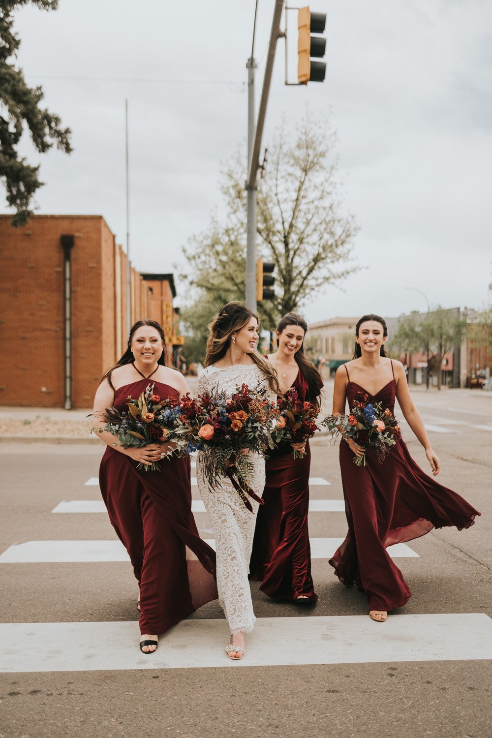 Plume&Furrow-Wedding-Florist-Kaiti&Joe-theStVrain-May-Colorado-JillHouserPhoto-bride-bridesmaids-bouquets-street-crossing.jpg