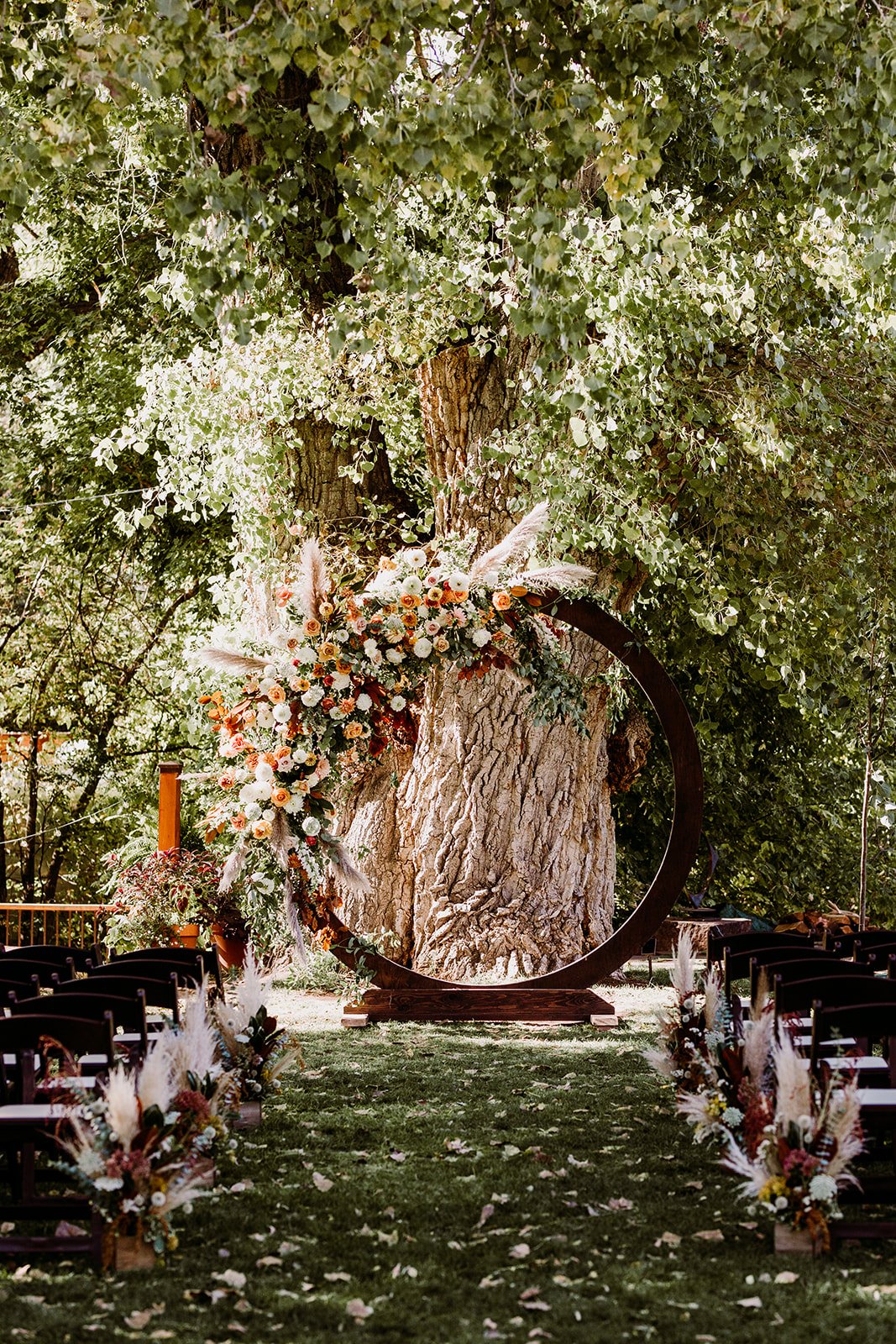 Plume&Furrow-WeddingFlorist-Garrison&Gabriella-TaylerCarlisle-Lyons-Farmette-October-Colorado-Ceremony-Decor-Arbor-Flower-Aisle-Boxes.jpg