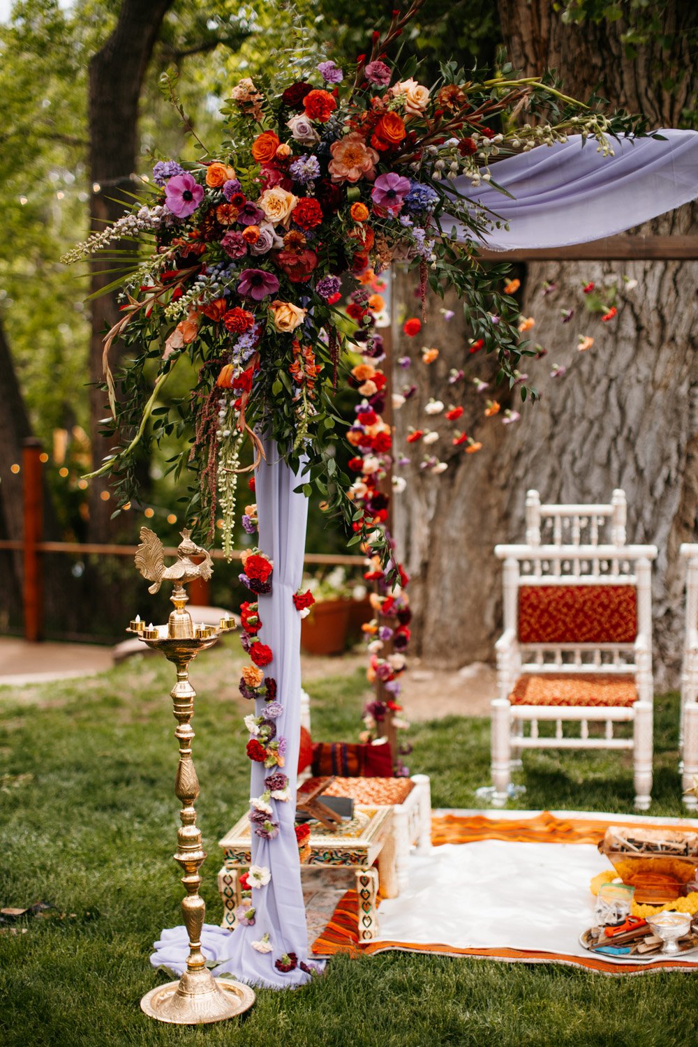 Plume&Furrow-Colorado-Wedding-Florist-Priya&Andrew-MalloryMunsenPhoto-Lyons-Farmette-May-ceremony-arbor-flowers-spray.jpg