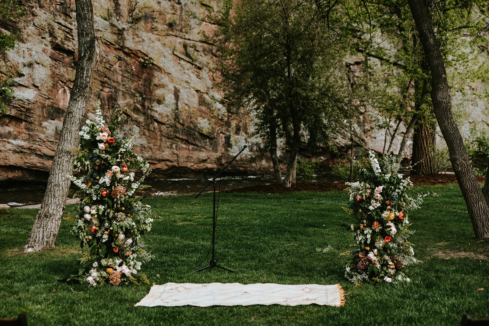 Plume&Furrow-Wedding-Florist-Amber&Matt-JenniferMorgan-Planet-Bluegrass-May-Colorado-Ceremony-Floral-Pillars-Riverside.jpg