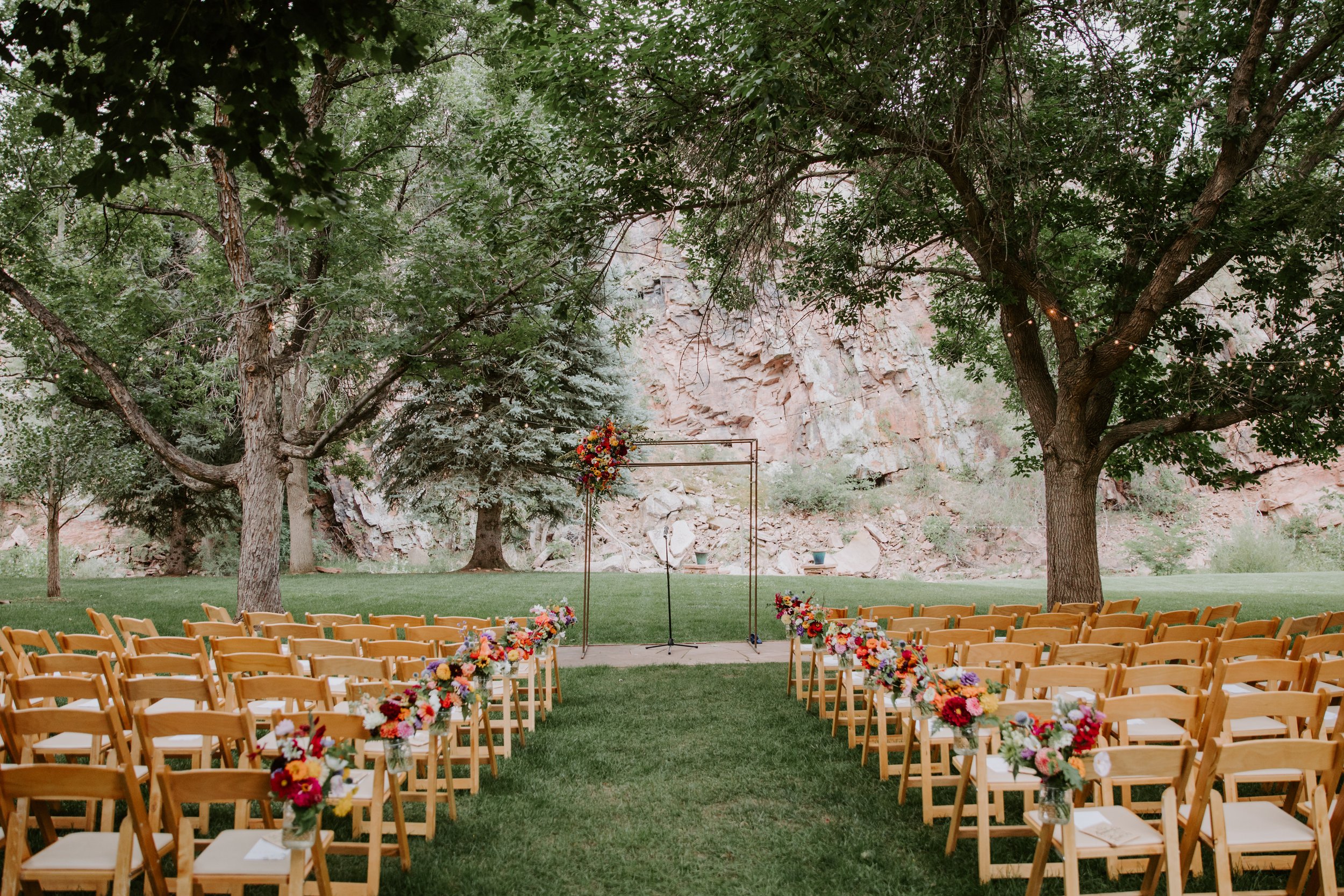 Plume&Furrow-Wedding-Florist-Sarah&Jordan-AshleyTiedgenPhotography-River-Bend-August-Colorado-Ceremony-Space-Arbor-Decor.jpg