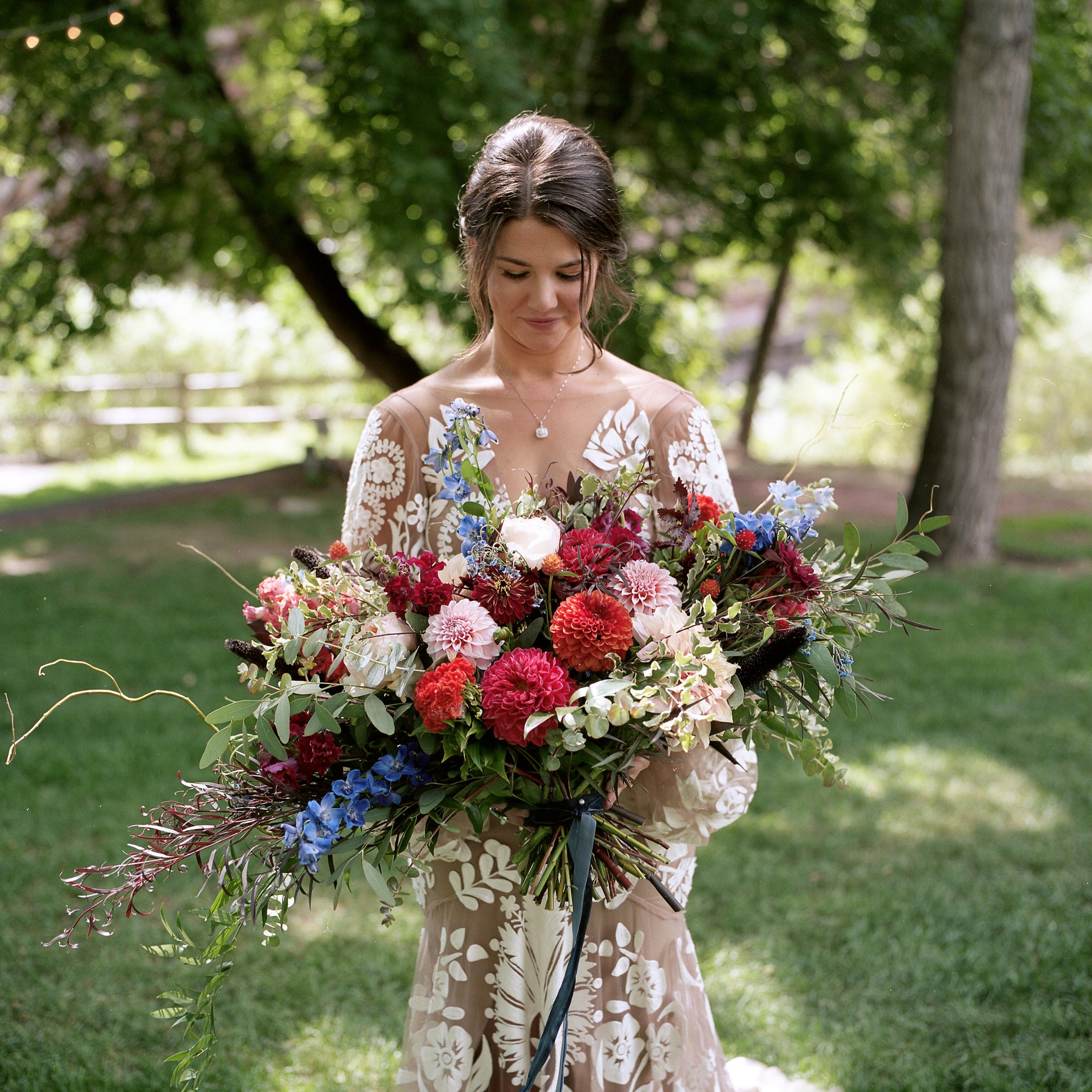 Plume&Furrow-Wedding-Florist-Kayla&Scott-AdamHouseman-River-Bend-September-Colorado-Bride-Looking-Bridal-Bouquet.jpg