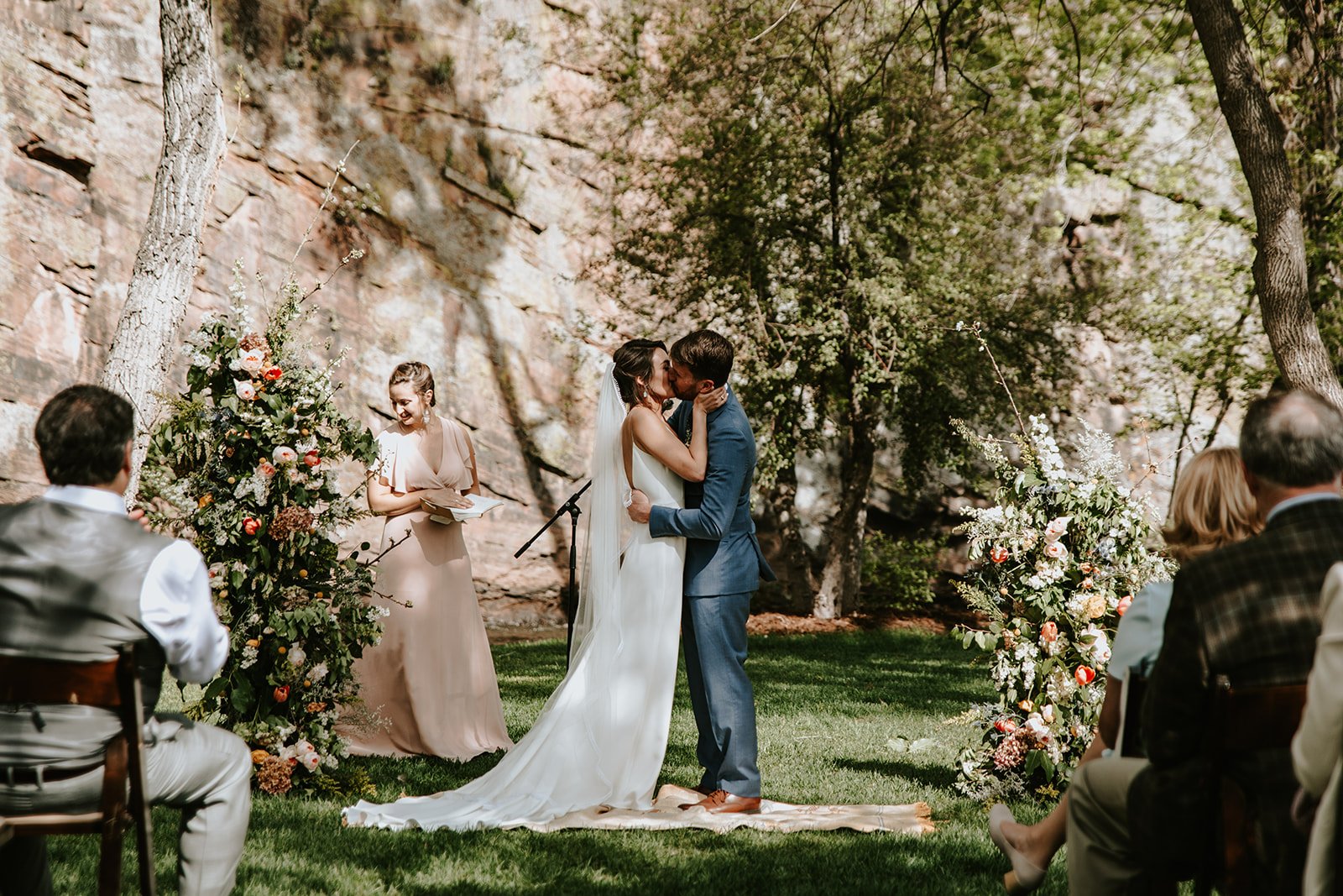 Plume&Furrow-Wedding-Florist-Amber&Matt-JenniferMorgan-Planet-Bluegrass-May-Colorado-Couple-Vows-Kiss-Riverside.jpg