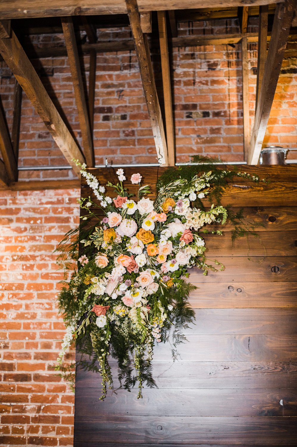 Plume&Furrow-Wedding-Florist-Morgan&Colby-theStVrain-June-Colorado-Function+FlourishPhoto-details-ceremony-spray-peach-pink-white-greenery.jpg