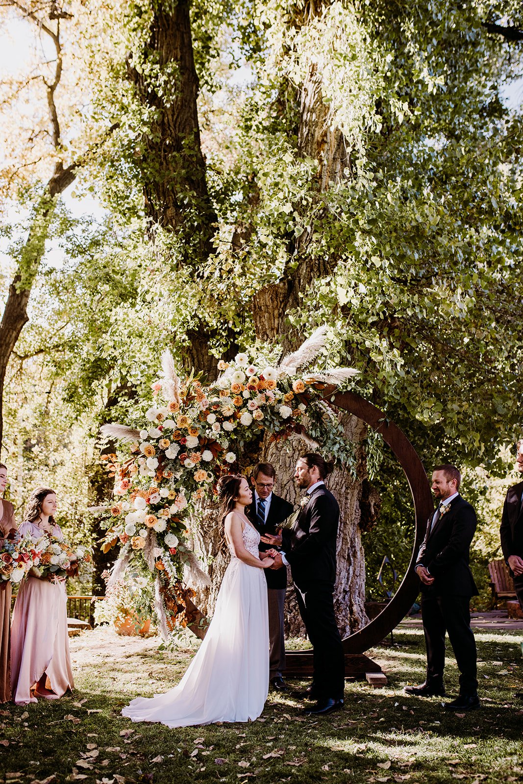 Plume&Furrow-WeddingFlorist-Garrison&Gabriella-TaylerCarlisle-Lyons-Farmette-October-Colorado-Bride-Groom-Ceremony-Arbor.jpg