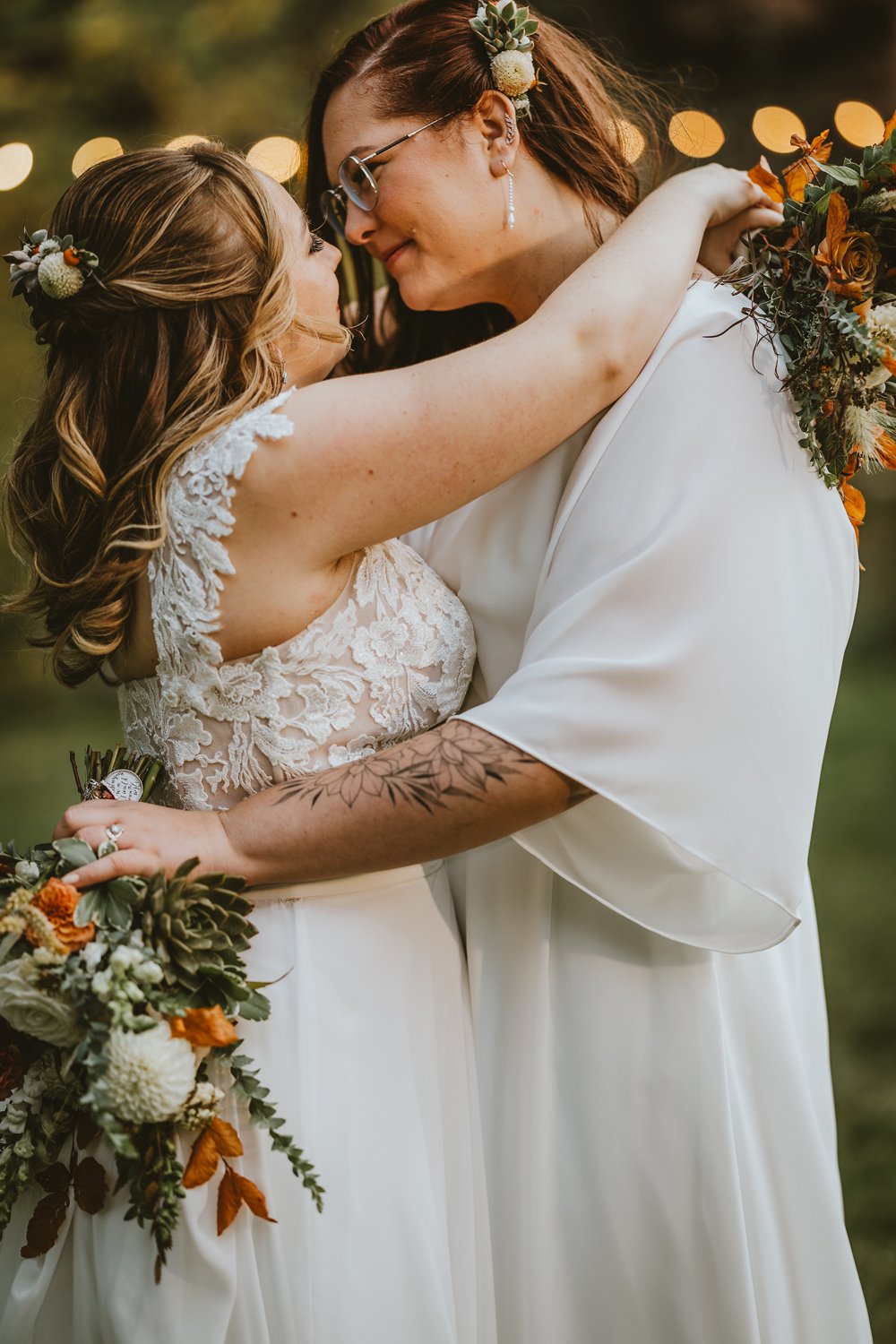 Plume&Furrow-Wedding-FLorist-Kennedy&Jena-IvyBencheckPortraits-River-Bend-LGBTQ-September-Colorado-Brides-Hug-Flowers.jpg