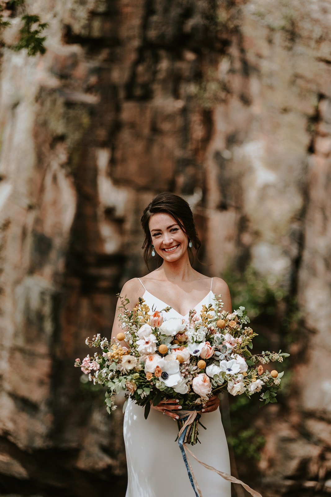 Plume&Furrow-Wedding-Florist-Amber&Matt-JenniferMorgan-Planet-Bluegrass-May-Colorado-Bridal-Bouquet-Canyon-Wall.jpg