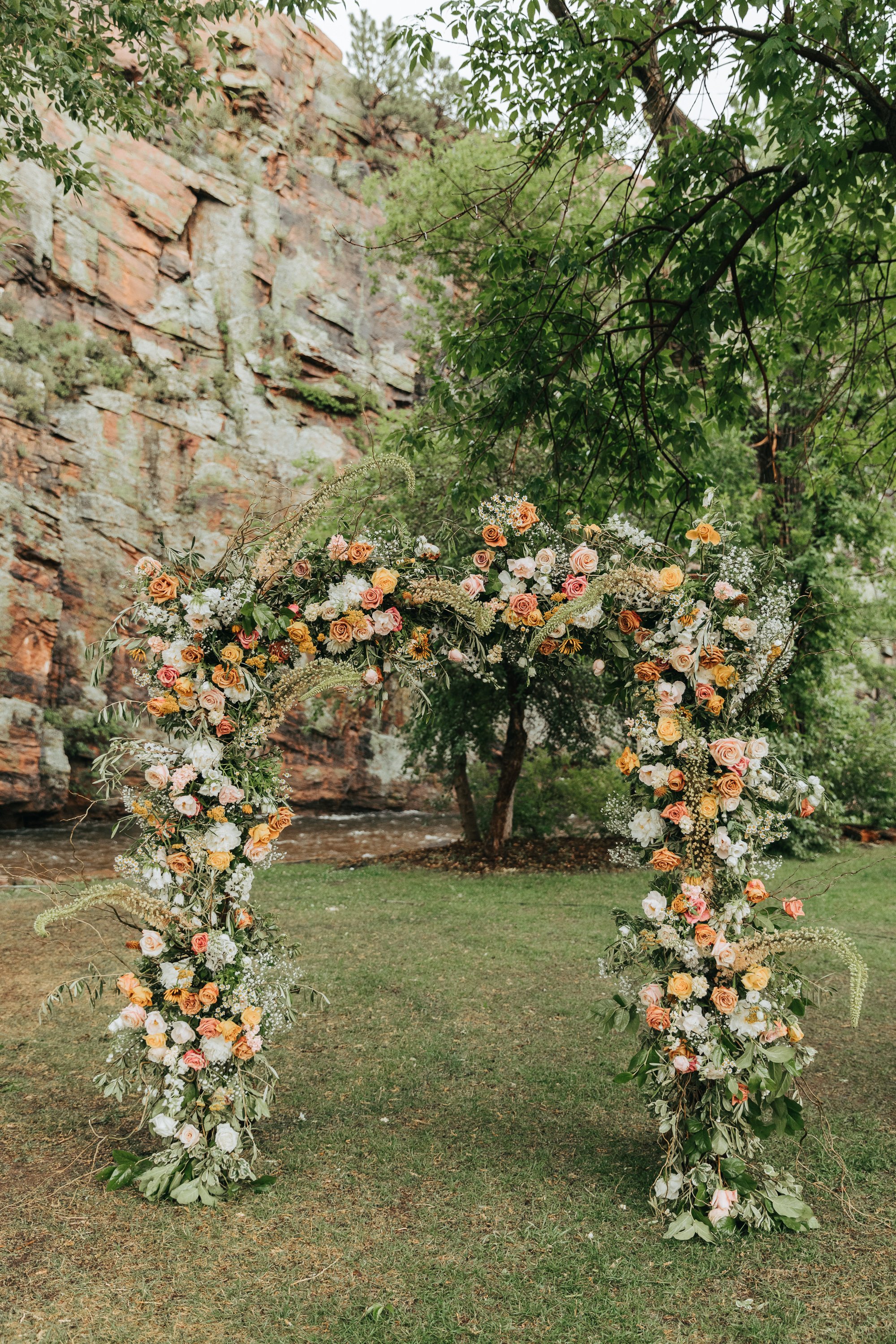 Plume&Furrow-WeddingFlorist-Katie&Worth-AliciaDelia-Planet-Bluegrass-July-Colorado-Full-Floral-Wedding-Arbor-Decoration.jpg