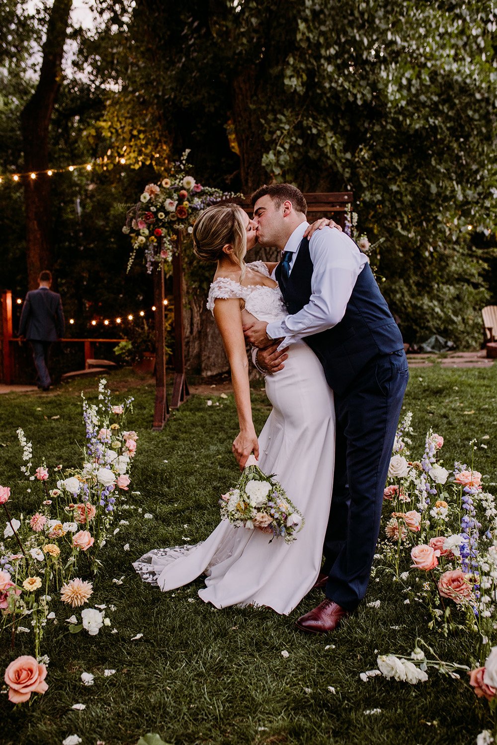 Plume&Furrow-Colorado-Wedding-Florist-Emily&Charlie-TaylerCarlislePhoto-Farmette-September-bride-groom-first-look-kiss.jpg