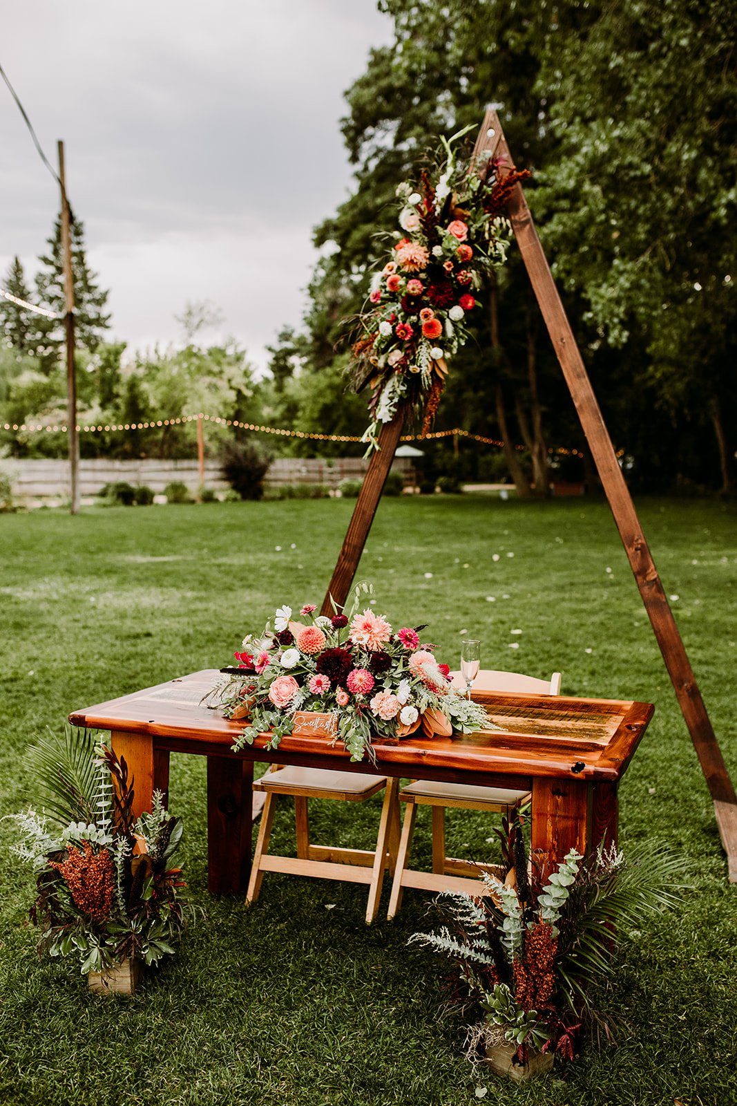Plume&Furrow-WeddingFlorist-Emily&Eva-TaylerCarlisle-LyonsFarmette-September-Colorado-Head-Table-Arbor-Table-Garden.jpg