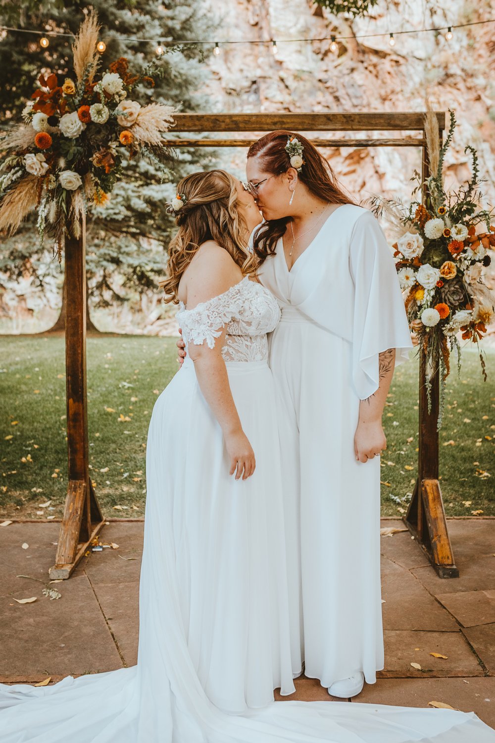 Plume&Furrow-Wedding-FLorist-Kennedy&Jena-IvyBencheckPortraits-RiverBend-LGBTQ-September-Colorado-Brides-Kiss-Ceremony-Arch.jpg