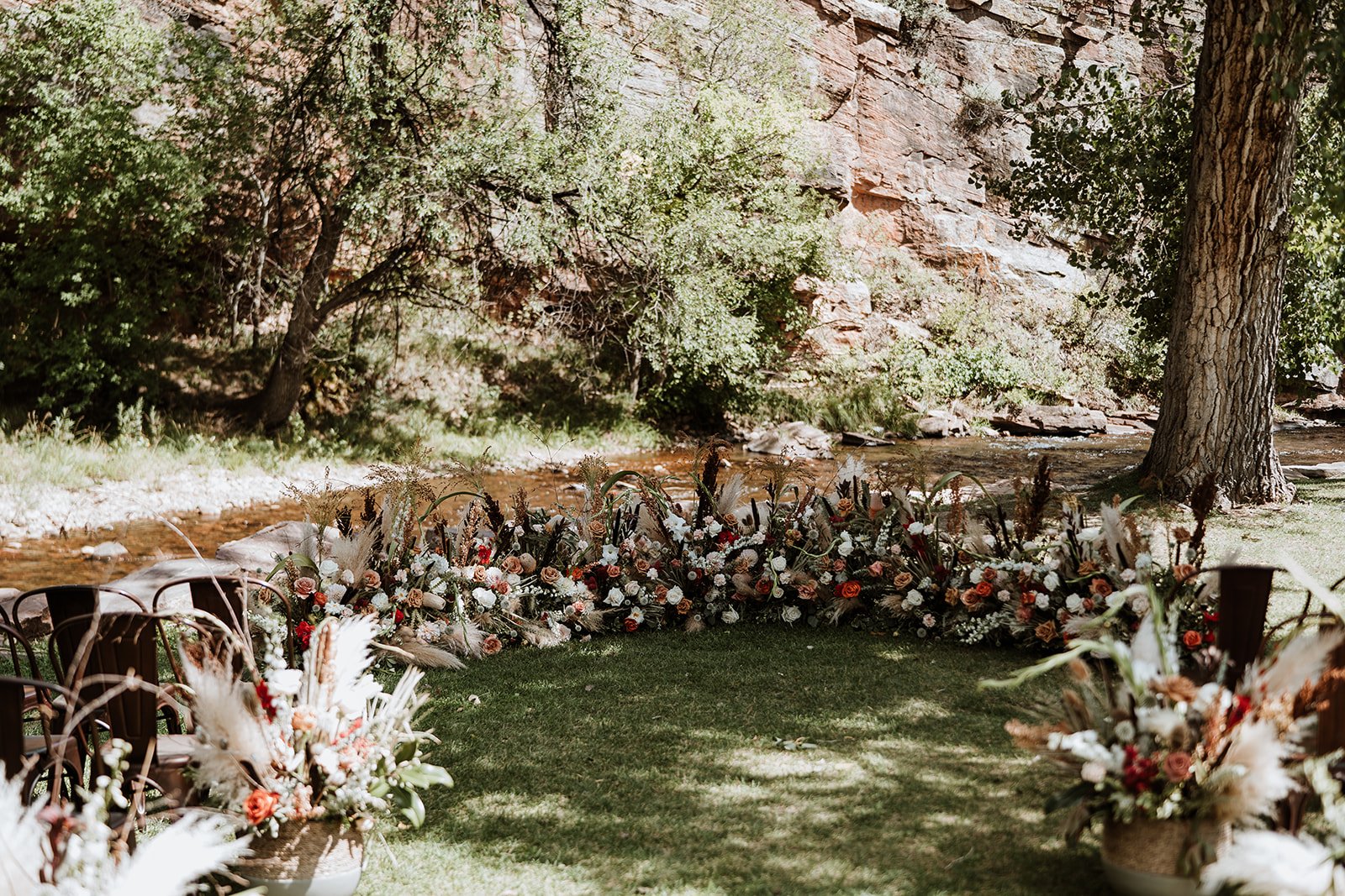 Plume&Furrow-Wedding-Florist-Jess&Jonny-BasecampVisual-Planet-Bluegrass-August-Colorado-Ceremony-Decor-Ground-Arch-Aisle.jpg