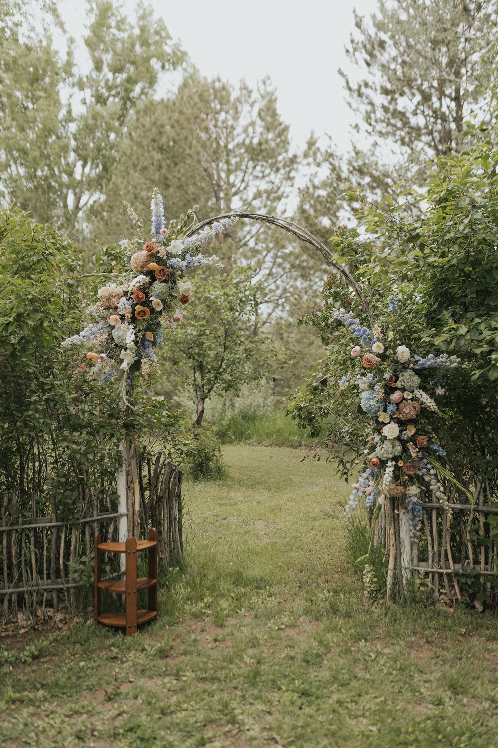 Plume&Furrow-Wedding-Florist-theMandinos-AbbyRindelPhoto-LoneHawk-Farm-Colorado-June-ceremony-arch-floral-decor.jpg