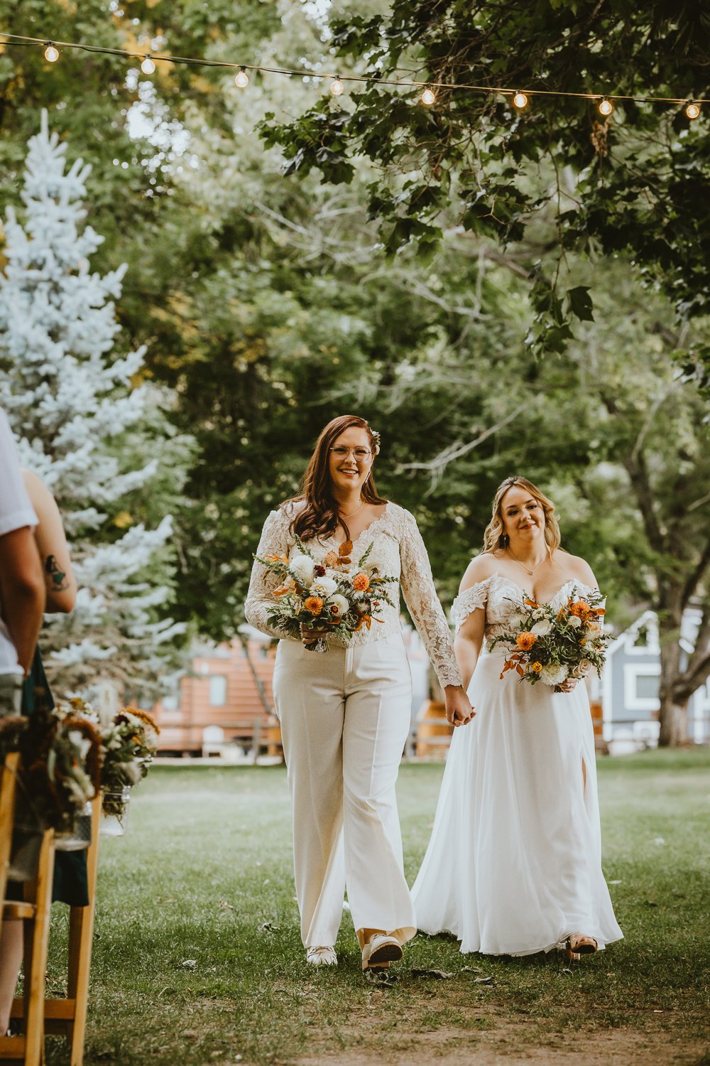 Plume&Furrow-Wedding-FLorist-Kennedy&Jena-IvyBencheckPortraits-River-Bend-LGBTQ-September-Colorado-Brides-Down-Aisle-Flowers.jpg