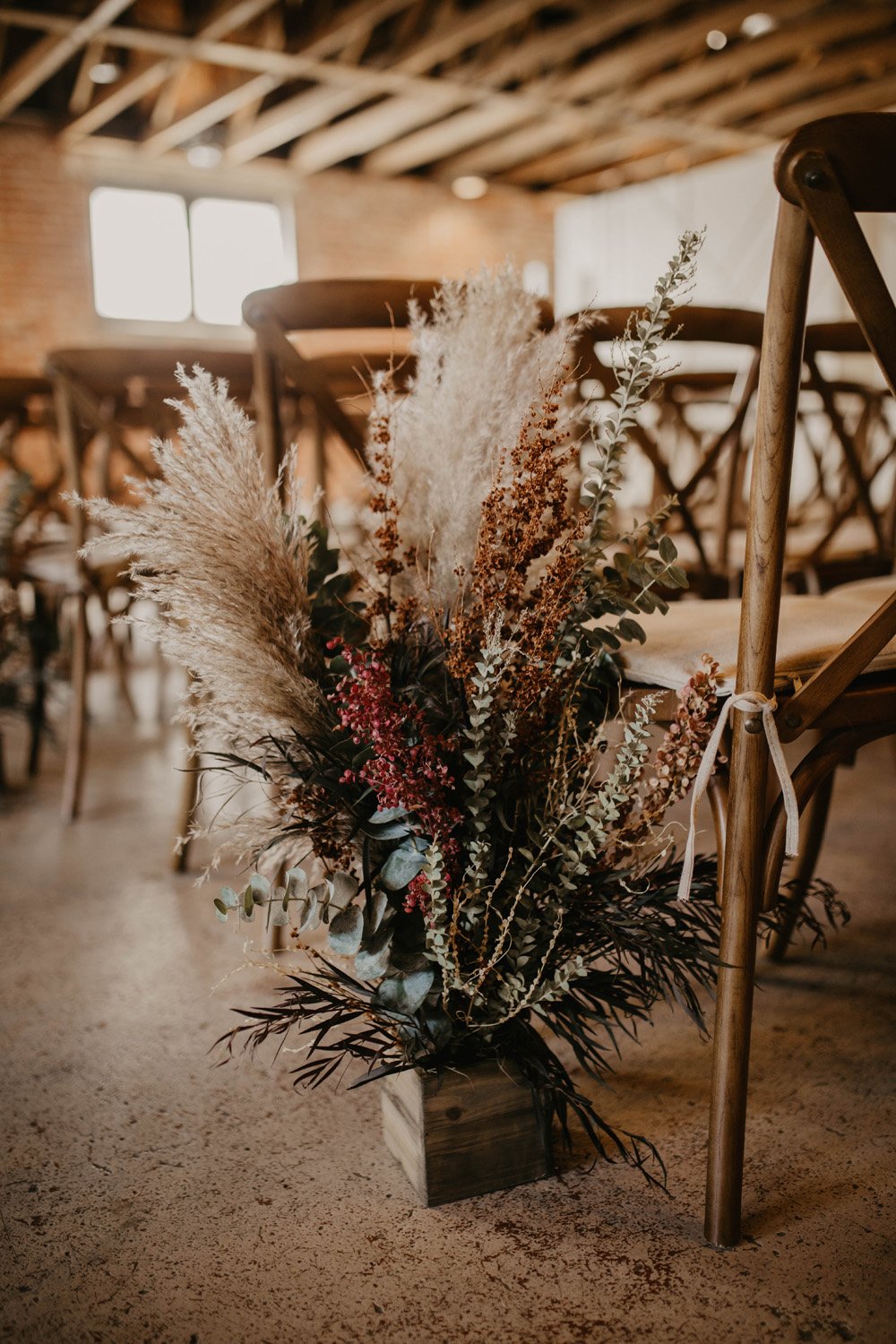 Plume&Furrow-Wedding-Florist-Cloe&Connor-theStVrain-September-Colorado-GracieMariePhoto-details-aisle-dried-flower-arrangement.jpg