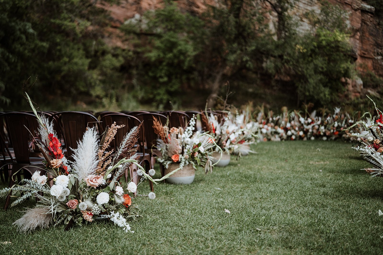 Plume&Furrow-Wedding-Florist-Jess&Jonny-BasecampVisual-Planet-Bluegrass-August-Colorado-Ceremony-Aisle-Decor-Ground-Arch.jpg
