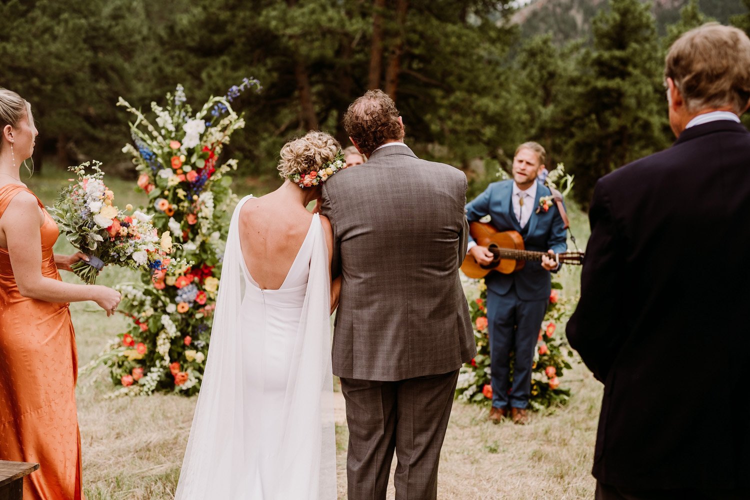 Plume&Furrow-Wedding-Florist-Talie&Forrest-Boulder-County-Colorado-TaylerCarlisle-groom-sings-song.jpg