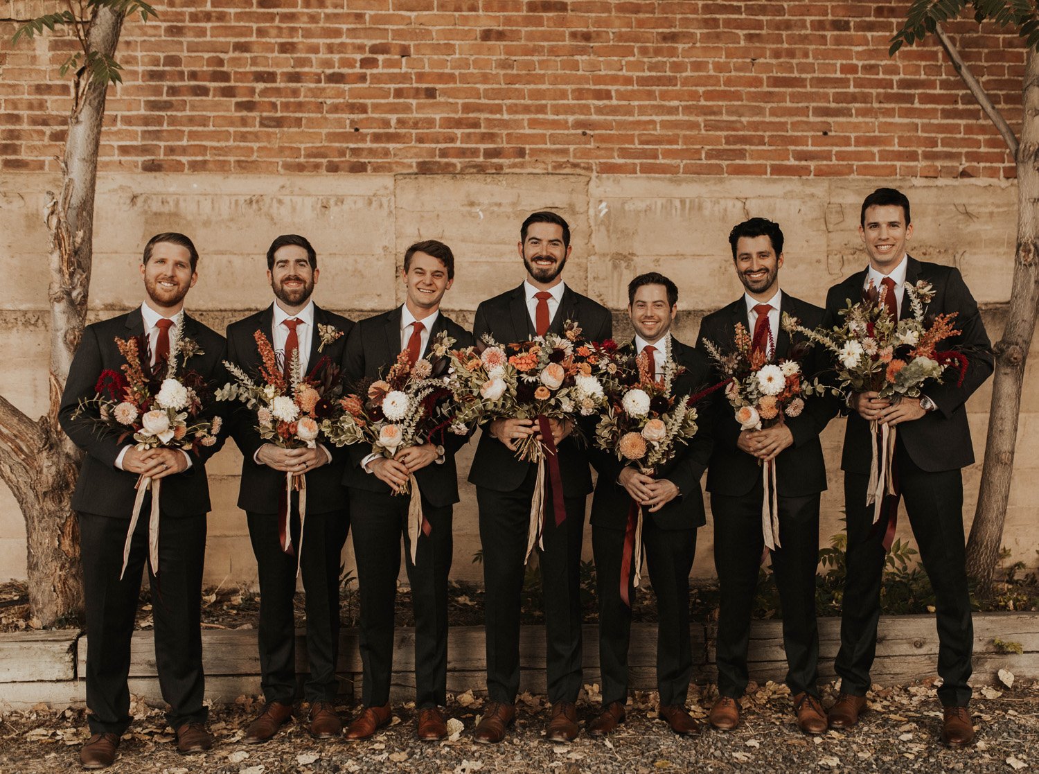Plume&Furrow-Wedding-Florist-Cloe&Connor-theStVrain-September-Colorado-GracieMariePhoto-groomsmen-with-bouquets.jpg