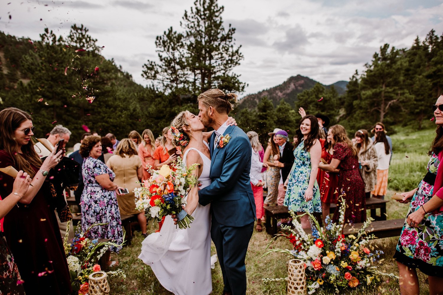 Plume&Furrow-Wedding-Florist-Talie&Forrest-Boulder-County-Colorado-TaylerCarlisle-bride-groom-kiss-flowers-petal-toss.jpg