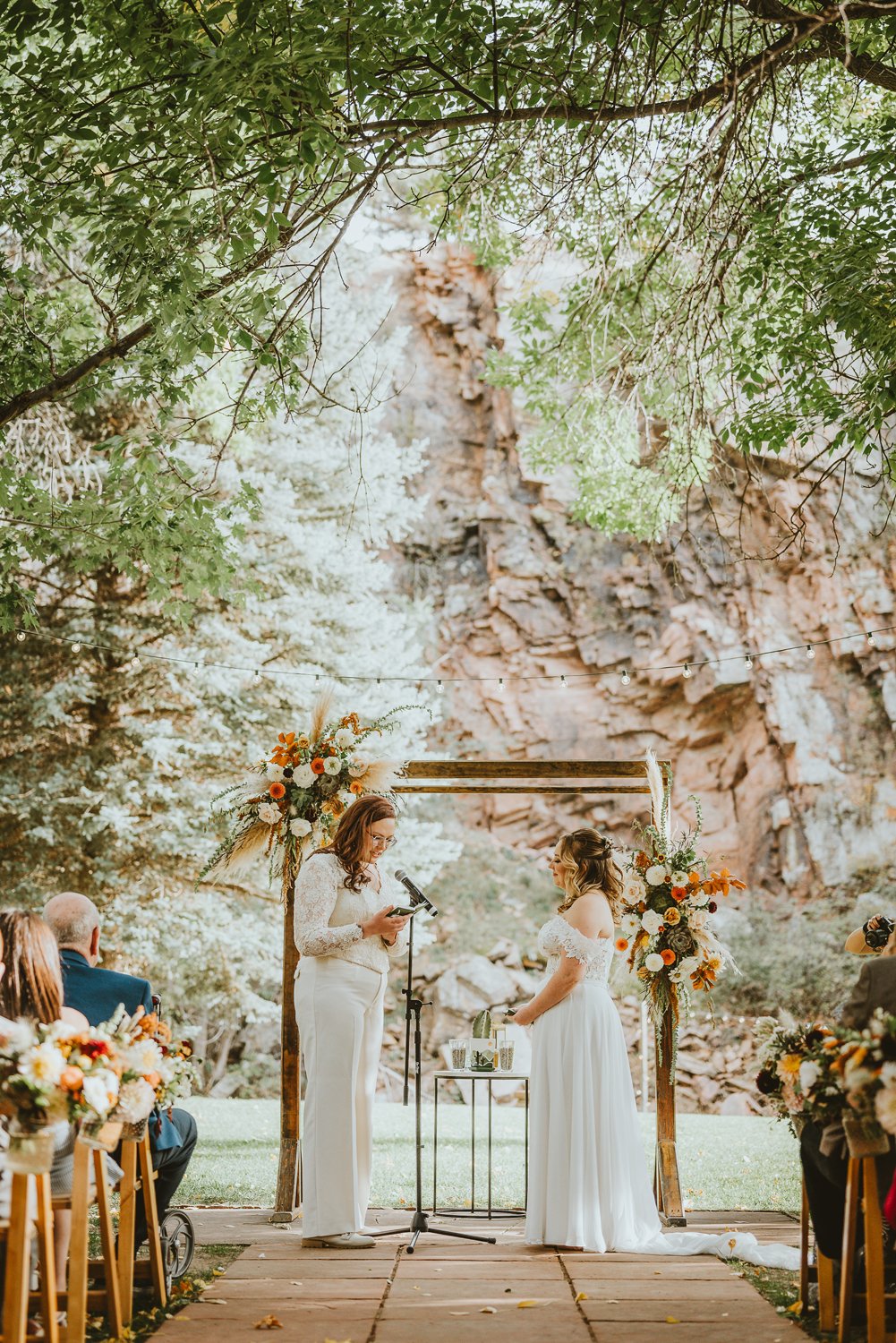Plume&Furrow-Wedding-FLorist-Kennedy&Jena-IvyBencheckPortraits-River-Bend-LGBTQ-September-Colorado-Ceremony-Decor-Canyon-Walls.jpg
