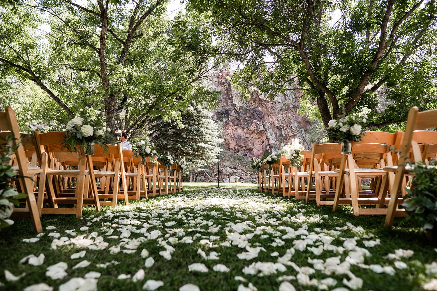 Plume&Furrow-Wedding-Florist-Megan&Jack-TaylerCarlislePhoto-RiverBend-August-Colorado-ceremony-aisle-petals.jpg