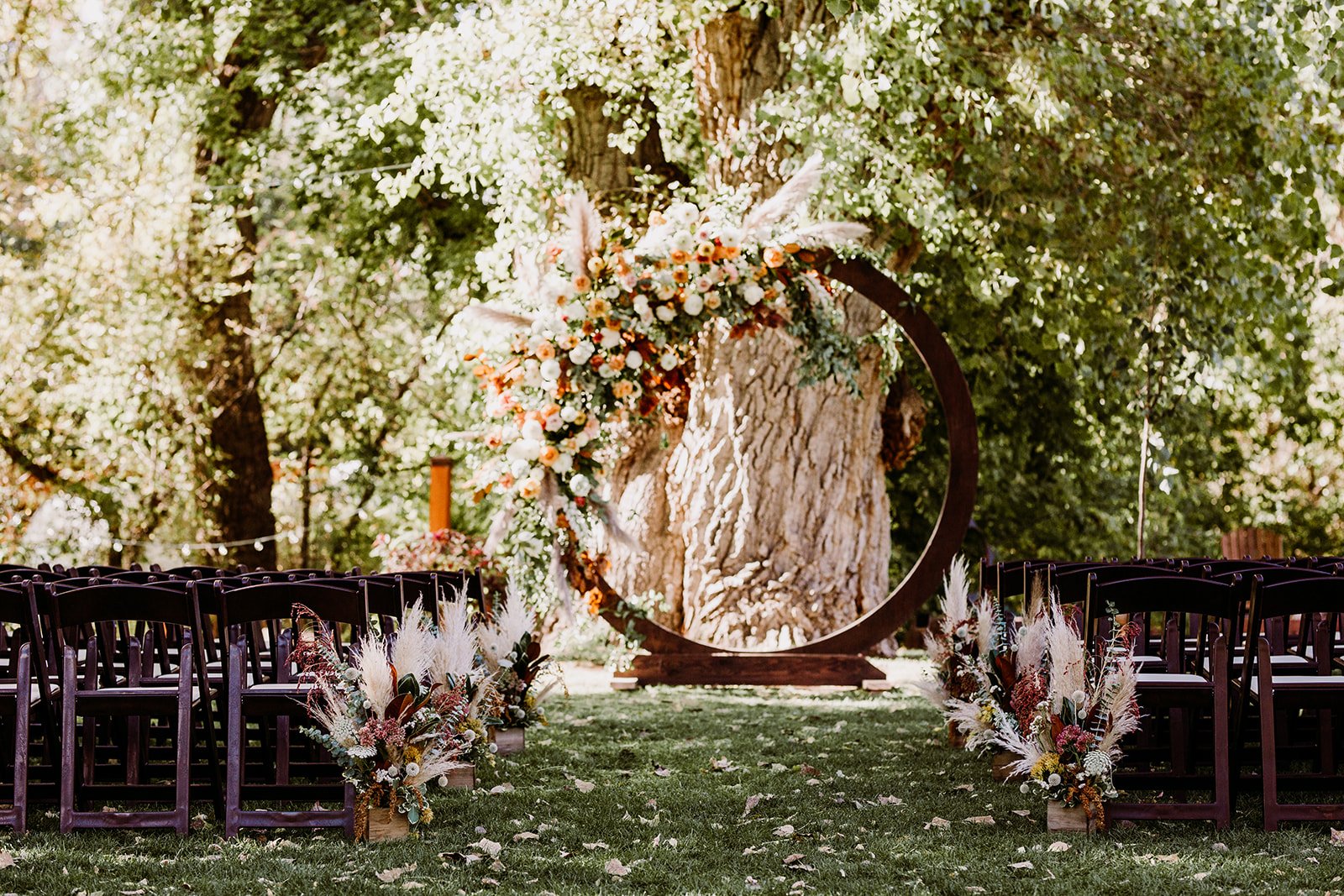 Plume&Furrow-WeddingFlorist-Garrison&Gabriella-TaylerCarlisle-Lyons-Farmette-October-Colorado-Ceremony-Decor-Floral-Arch-Arbor-Pampas-Grass.jpg