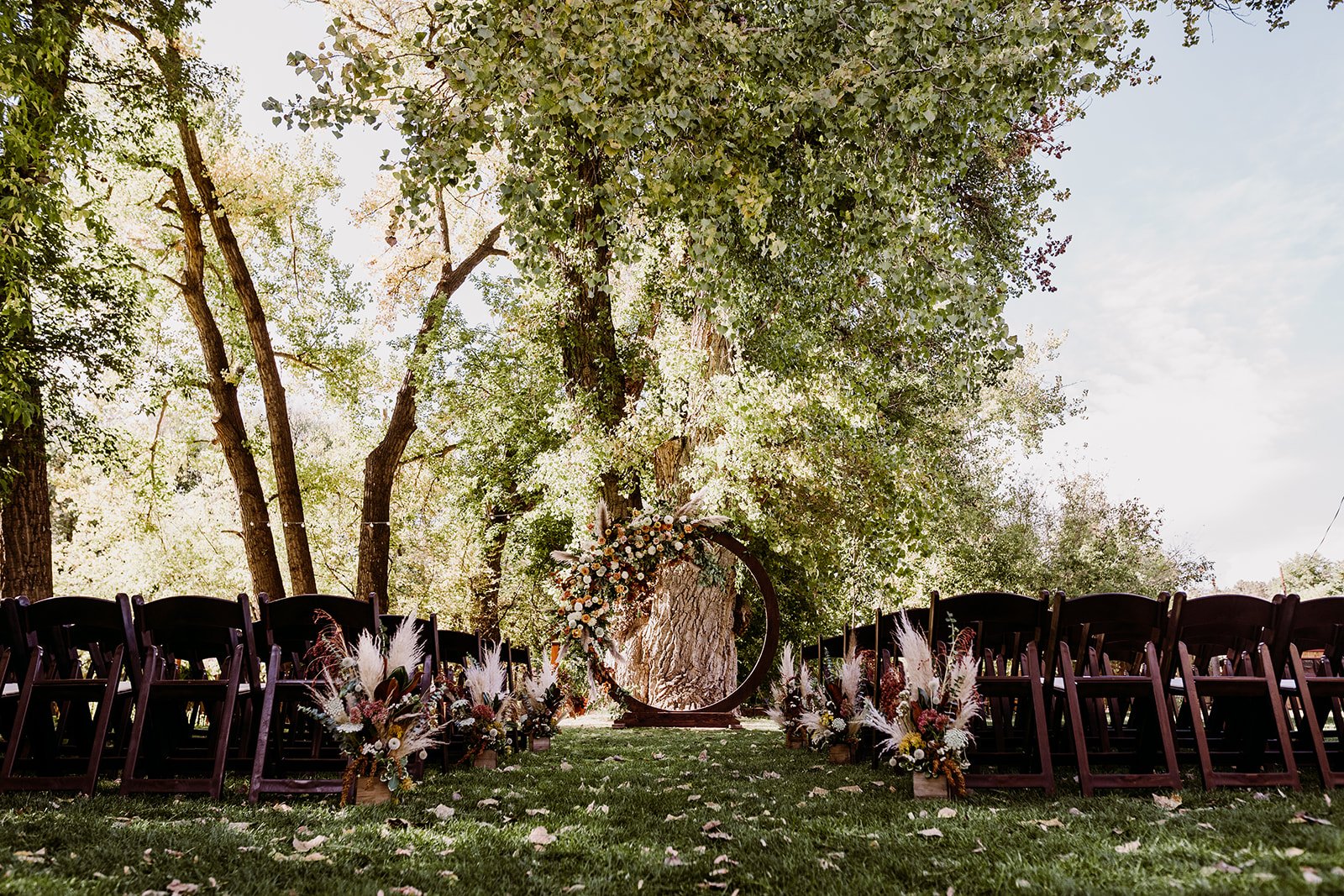 Plume&Furrow-WeddingFlorist-Garrison&Gabriella-TaylerCarlisle-Lyons-Farmette-October-Colorado-Ceremony-Arbor-Arch-Floral-Decor.jpg
