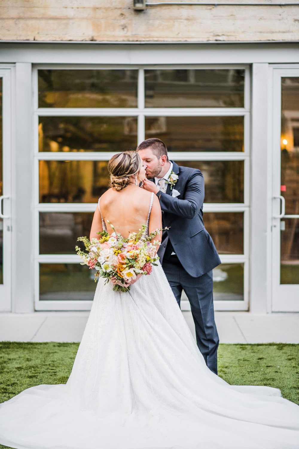 Plume&Furrow-Wedding-Florist-Morgan&Colby-theStVrain-June-Colorado-Function+FlourishPhoto-bridal-bouquet-kiss.jpg