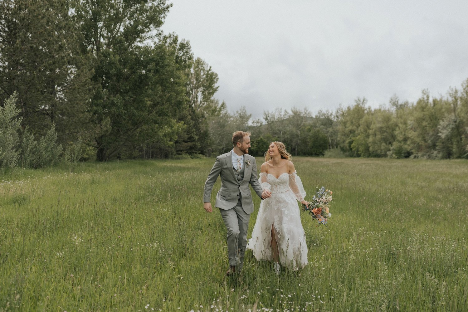 Plume&Furrow-Wedding-Florist-theMandinos-AbbyRindelPhoto-LoneHawk-Farm-Colorado-June-bride-groom-in-field.jpg