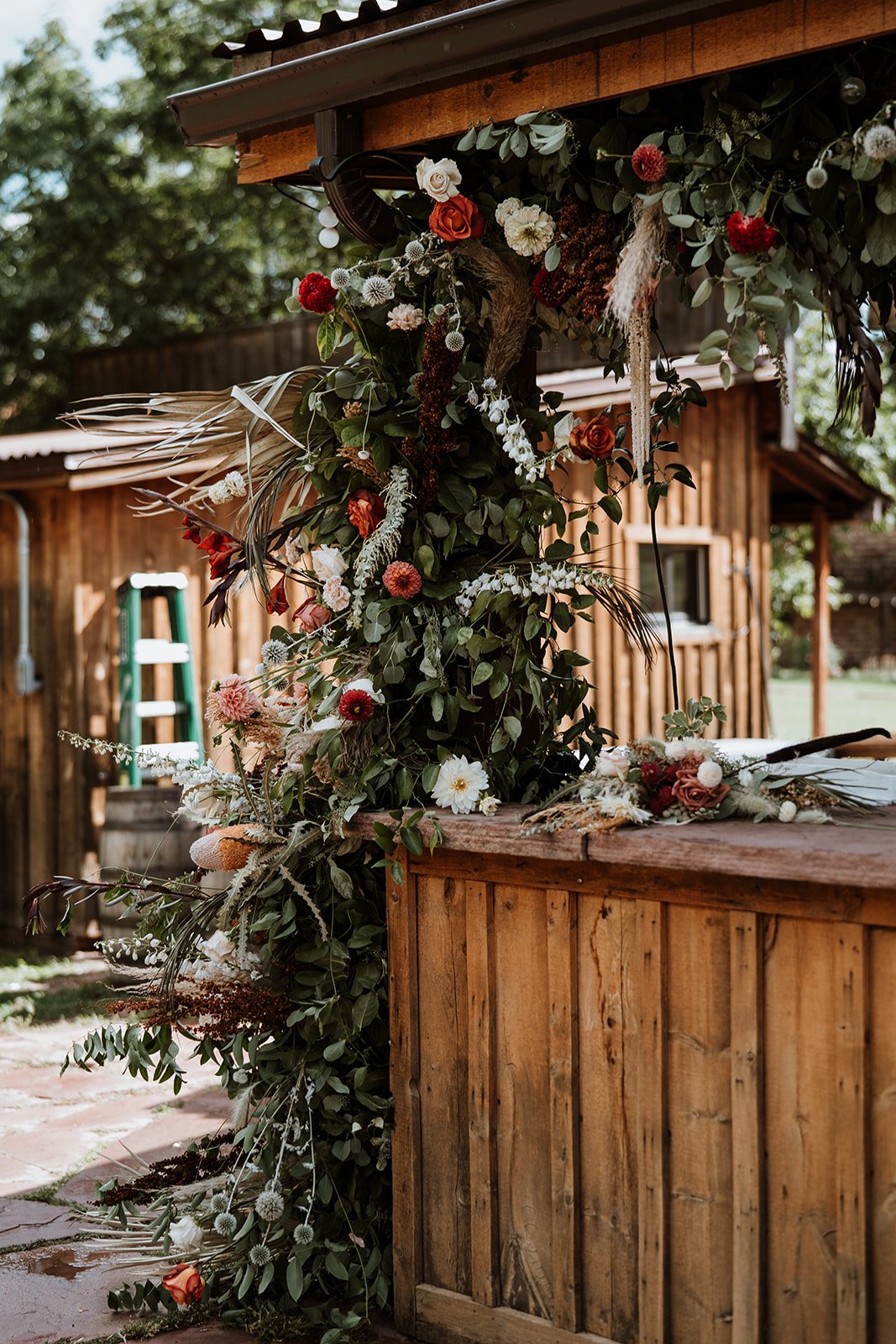 Plume&Furrow-Wedding-Florist-Jess&Jonny-BasecampVisual-Planet-Bluegrass-August-Colorado-Bar-Decor-Flowers-Greenery.jpg