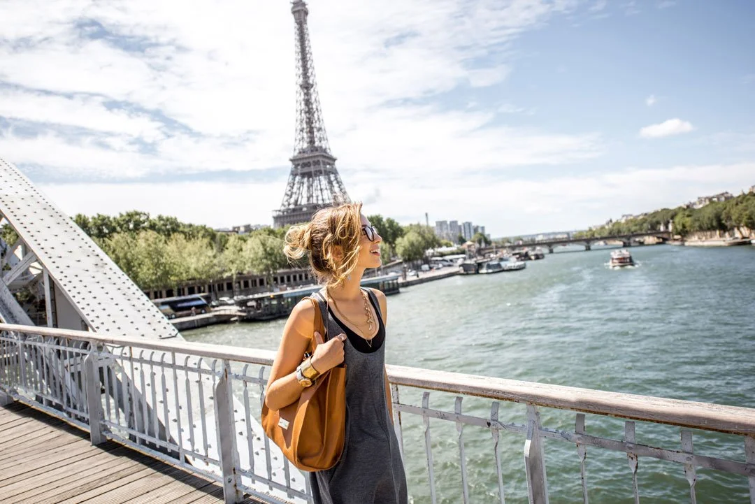 A woman walking in Paris, symbolizing inspiration and discovery