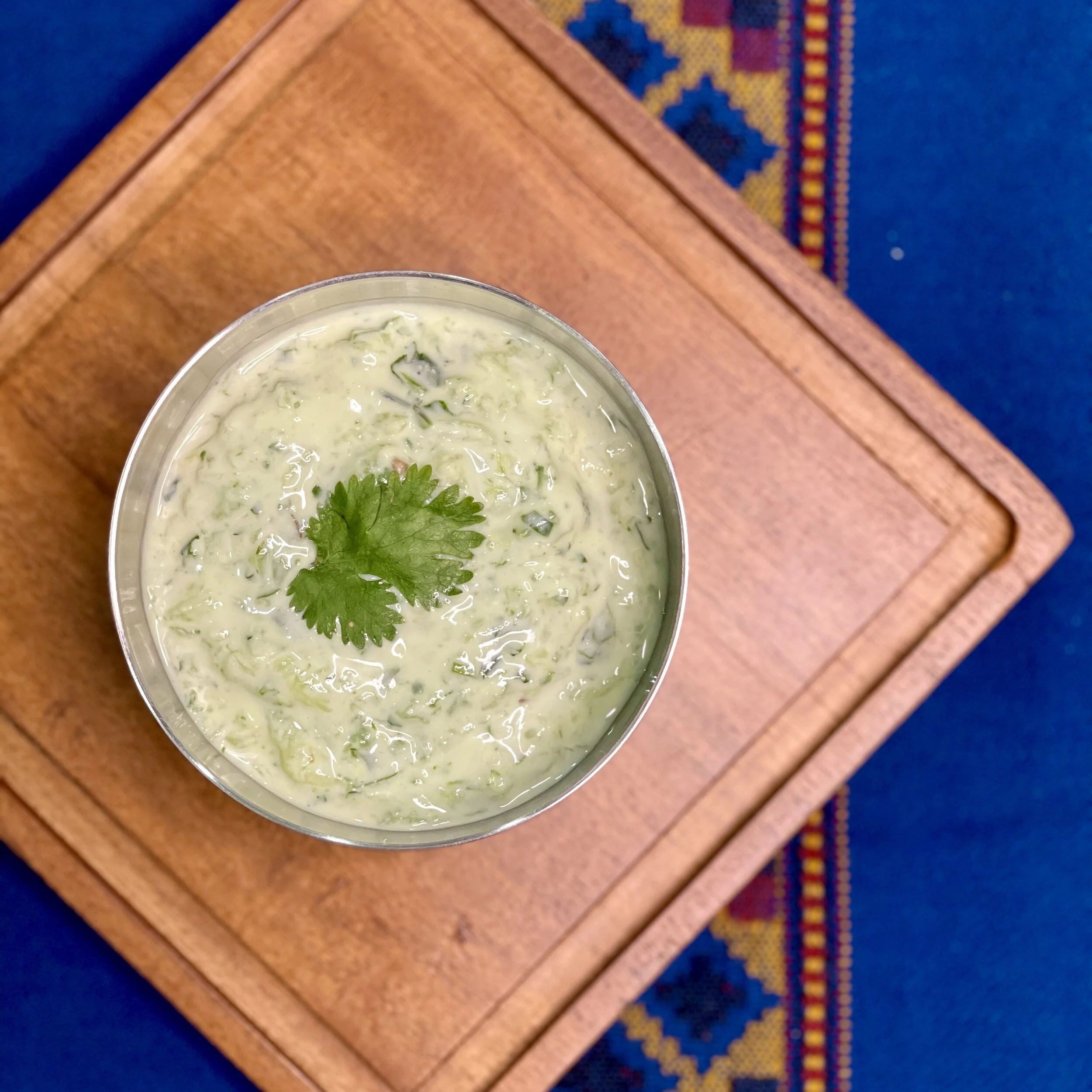 naani’s cucumber raita50g shredded cucumber, squeeze water  1 tbsp + 1 tsp finely chopped cilantro ¼ tsp mustard powder 1 green chilli ½ inch knob ginger ¼ tsp saltIn a food processor, blend green chilli, ginger and 1 tbsp cilantro to a fi…