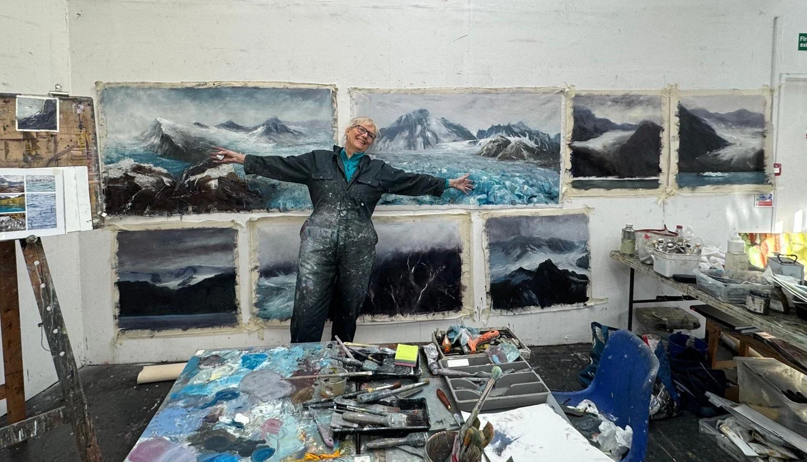 Jane and her paintings.JPG