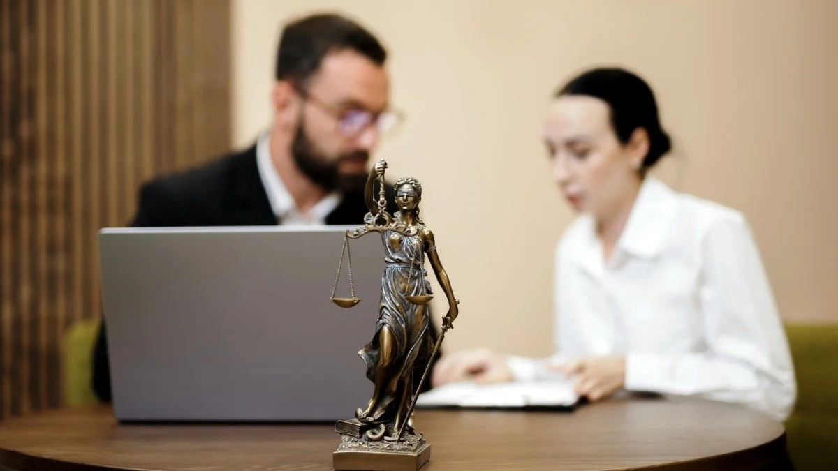 Lawyer and client going over legal paperwork in a bright, professional office concept of partnership and precision