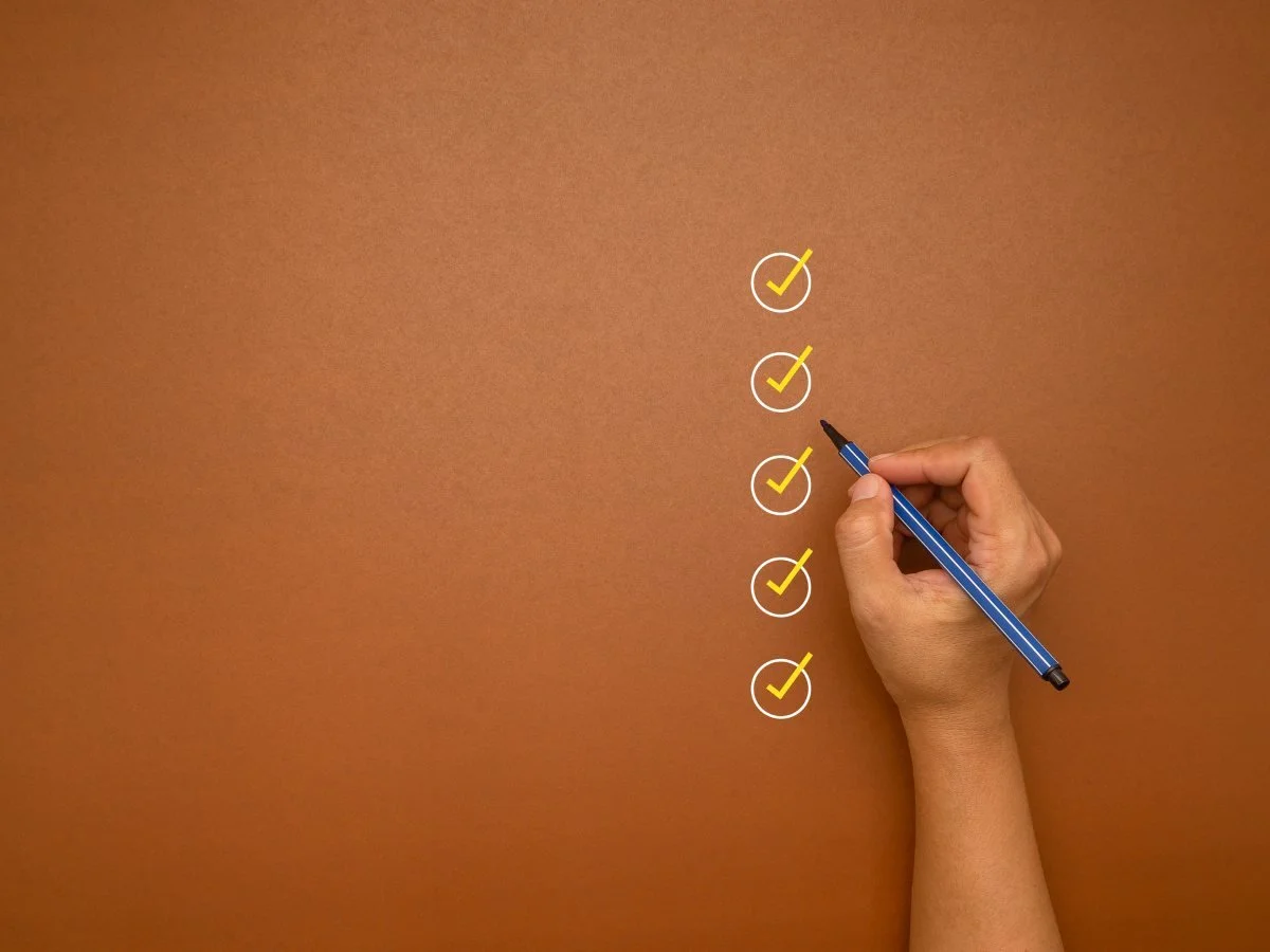 Yellow marking on checklist box over a brown background