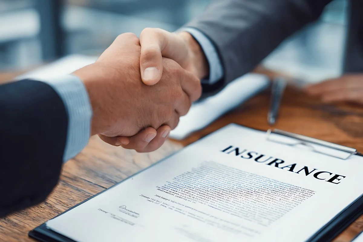 Trustworthy Handshake Over Insurance Contract, Symbolizing Secure Business Agreement