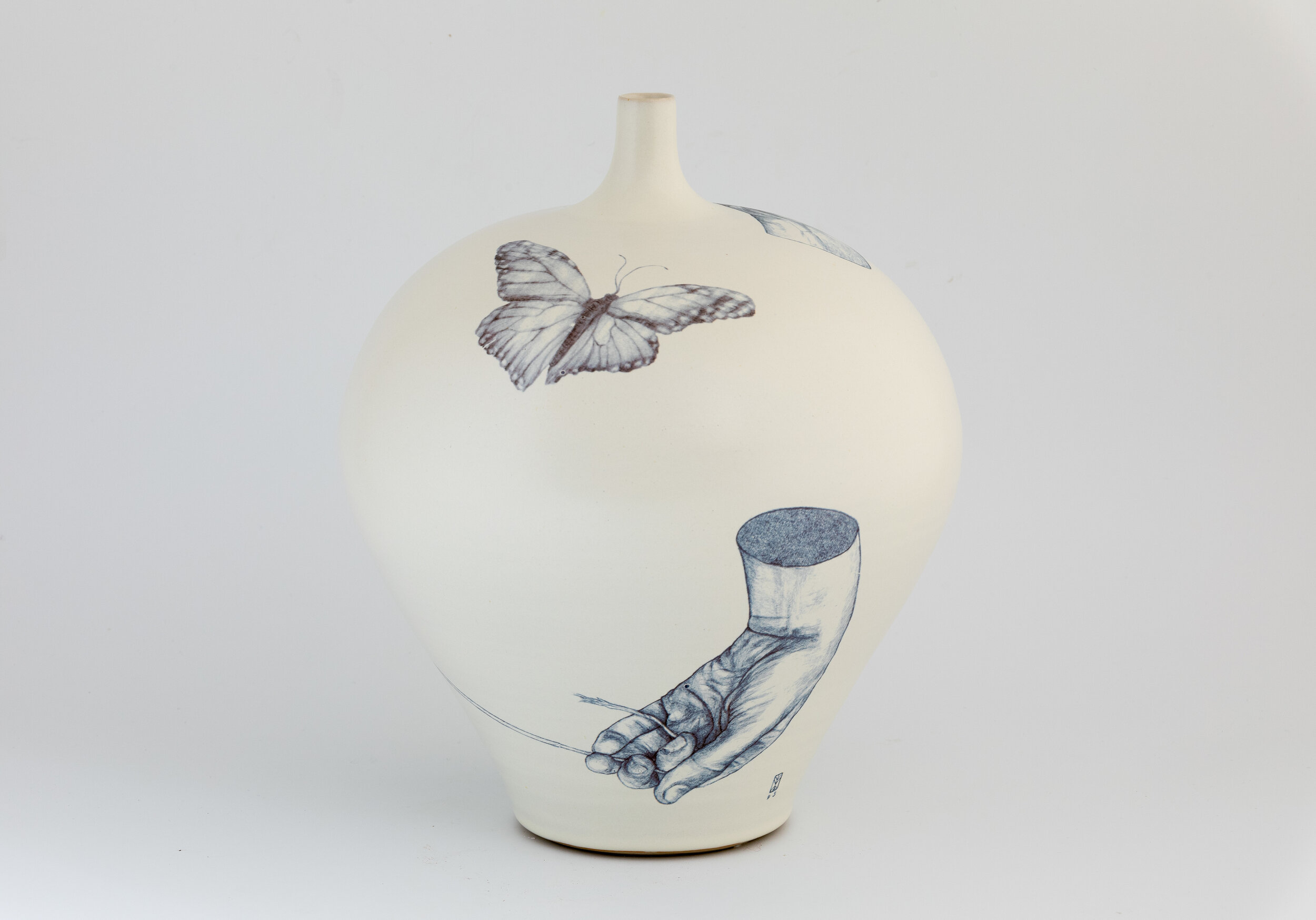 So it Goes (2020)
Stoneware bottle-neck vase in satin white glaze with decal decoration.
(Photography by Dylan Vaughn)