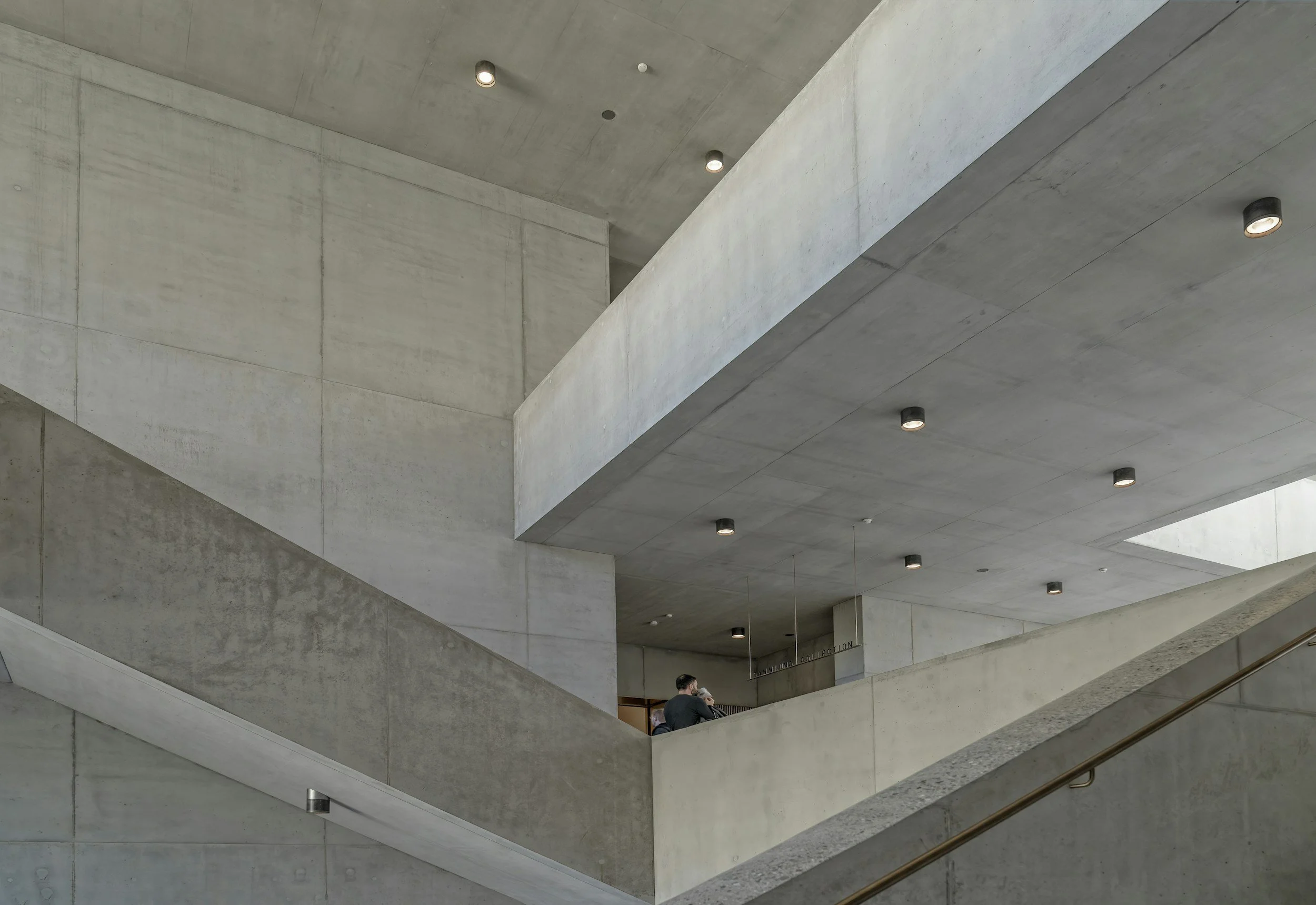 Modern architectural façade with restrained geometric lines and contemporary institutional design, reflecting the composed and discreet character of a Zürich-based advisory practice.