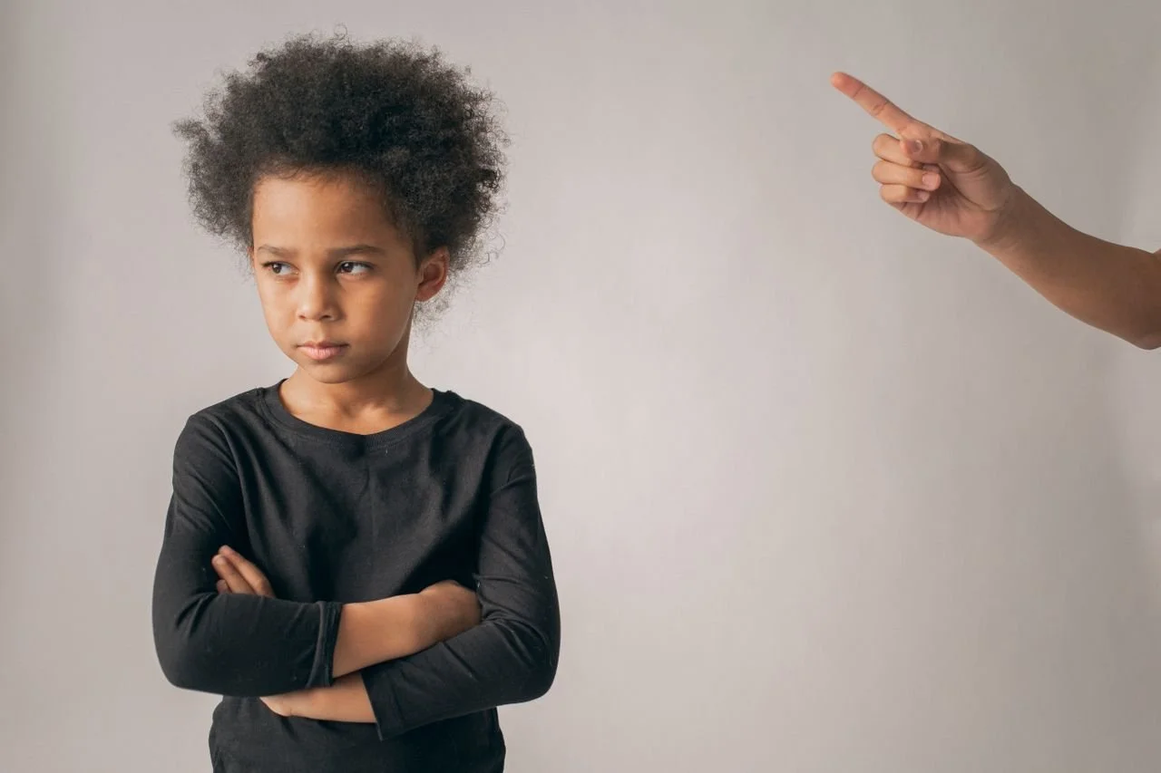 mother trying to discipline child after an angry outburst and aggression