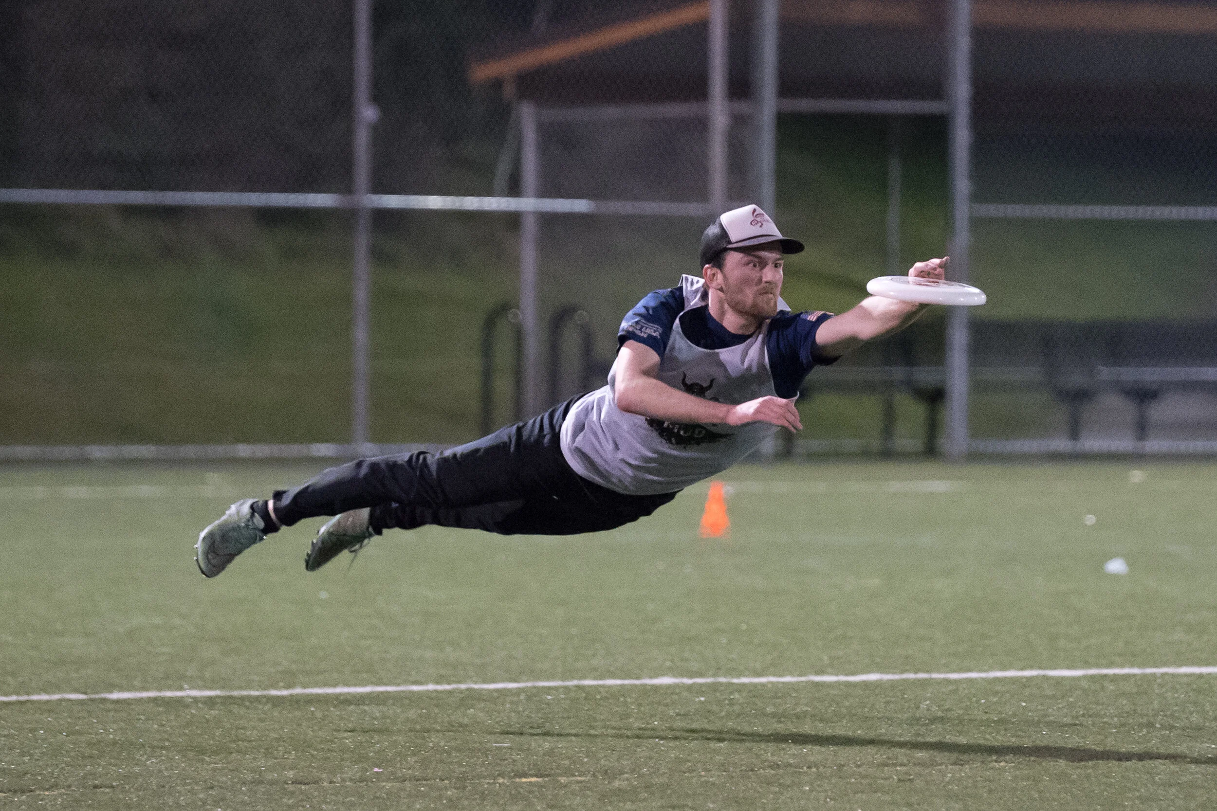 Jon Abramson lays out to catch a deflected pass for a score during a DiscNW league game at Jefferson Playfield.
