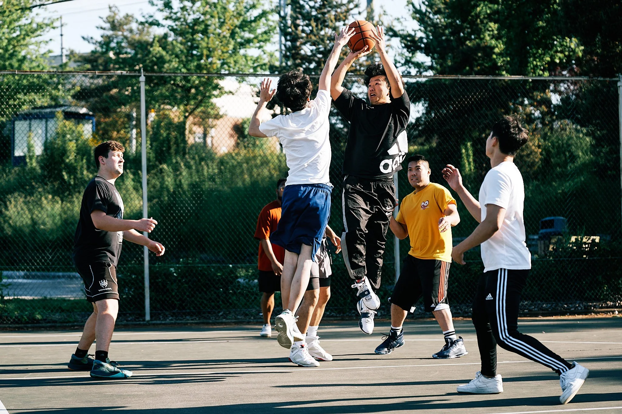 Basketball players at Van Asselt Playfield in Seattle.