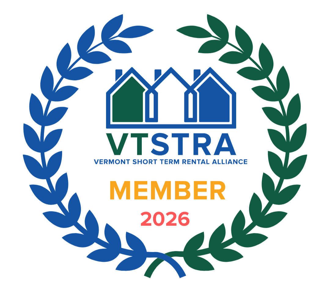 Vermont Short Term Rental Alliance Member badge with a laurel wreath, three houses, and the text indicating membership in 2026.