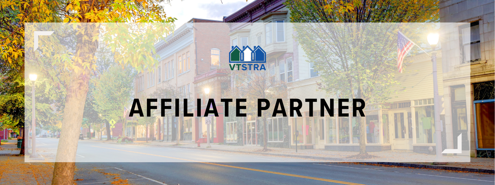 A quiet city street lined with trees with fall foliage, storefronts, and lampposts, with a logo and the text 'Affiliate Partner' overlayed.