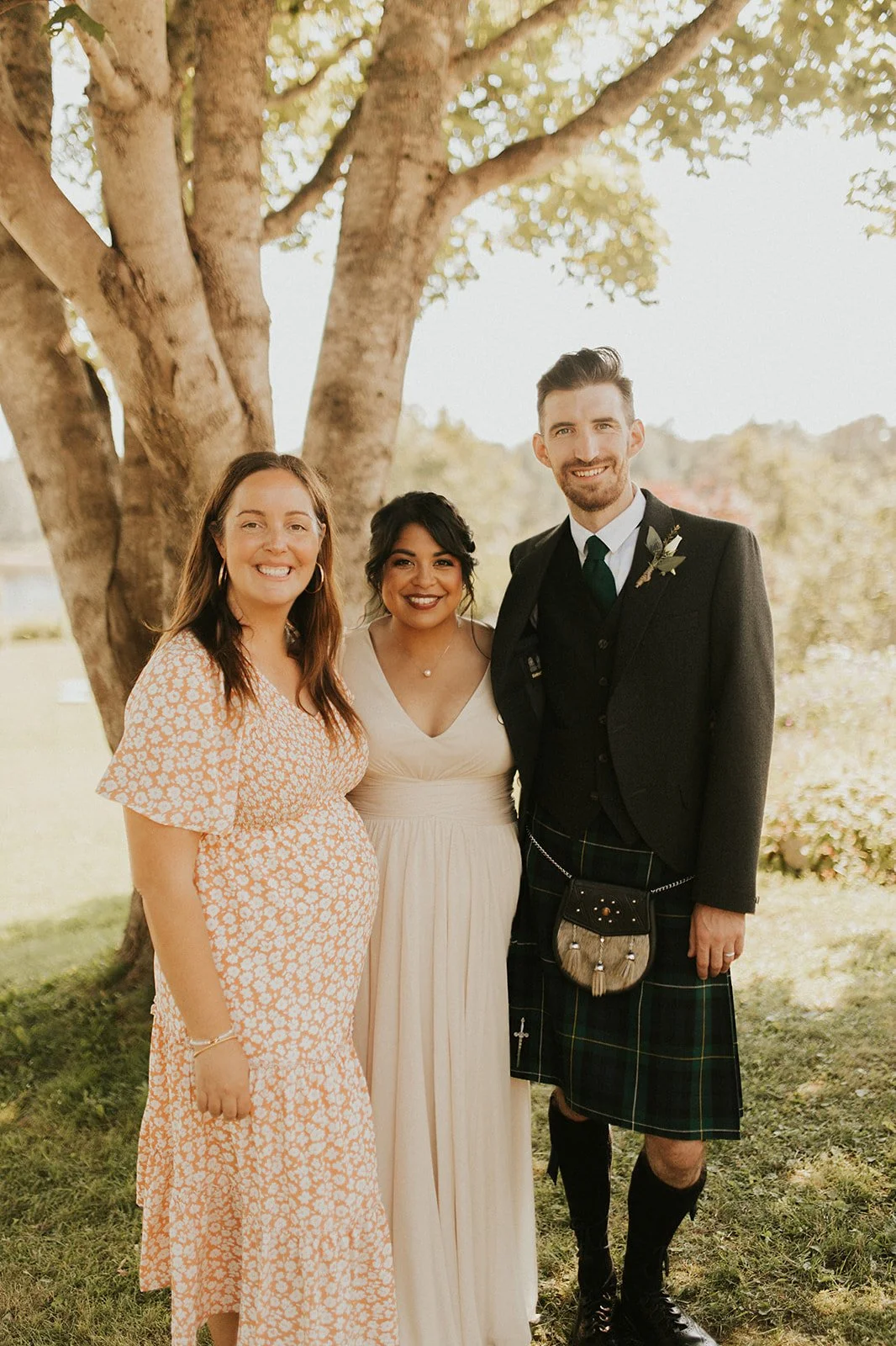 Bride and groom smiling with their JP