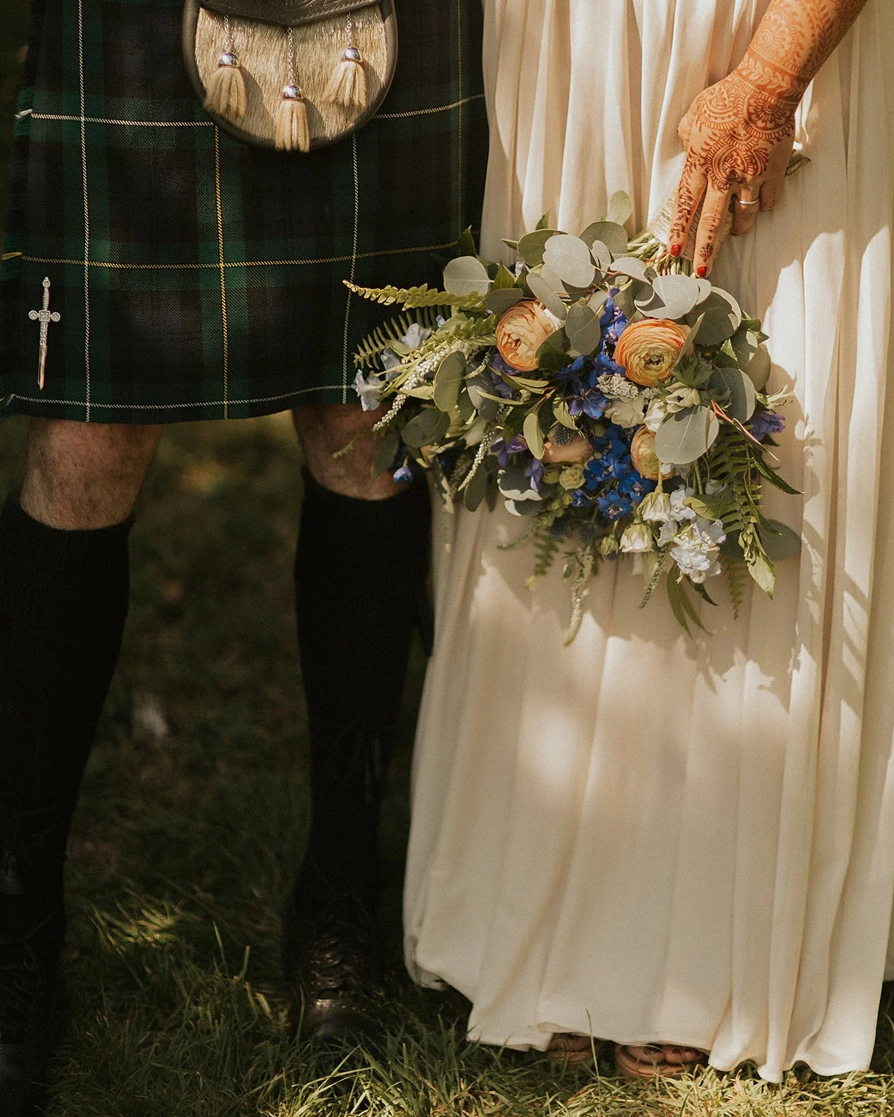 Bride and groom wedding details with flowers